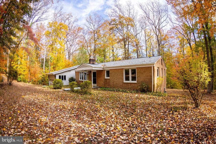 Nestled in the highly sought-after Moyaone Reserve, this one-of-a-kind, artisan crafted brick home sits on 5 acre at the end of a road. This house offers an opportunity to live in this woodland sanctuary while still enjoying Washington D.C. with a short drive. This unique home was lovingly built using natural materials sourced from the surrounding forest. It boasts four bedrooms, 2.5 bathrooms, a finished walk-out basement, a sunroom with a jacuzzi with a panoramic view of the forest, a sauna, a two-car garage, and plenty of storage space including a large attic and an oversized pantry. The woodland property includes a paved driveway, hiking trails and a custom built playhouse with a trampoline. This house was cared for with an attention to detail and the interior has an array of custom wooden features including doors and wall panels made from trees that were harvested on the property. The roof and the gutters recently updated (2024) with a. 50-year warranty, the wood fireplace is in good condition, the windows are all new, and each room has ceiling light. There is Central AC/heat with heat pump/oil combination, hardwood floor, motion detection lights around the house, and a large den in the basement. There is a large shed outside with a sun kiln for wood storage. The owners have created and maintained trails (see trail mapping pictures) with wooden bridges and stairs along the creek and have placed wooden benches around the property so you can relax and take in the beauty of the reserve. This hidden gem is more than a home, it’s a living work of art.

Located along the Potomac river, residents enjoy access to a community pool, a playground, hiking trails, and more. The nearby historical Piscataway Park is a pristine National Park with opportunities to fish, walk around a colonial farm, or gaze at George Washington's Mount Vernon estate located directly across the river. Living in the Moyaone Reserve means more than just owning a charming home—it’s about being part of a thriving community where residents gather regularly celebrate throughout the year at the community center.

You will want to walk around the property when you visit this unique house where you will most likely encounter wildlife such as deer, wild turkeys, ospreys, and bald eagles. Nearby attractions include the Fort Washington Park, the Ghost Fleet of the Potomac, and Port Tobacco.

It’s located 20 minutes from Waldorf, a 30 minutes from Alexandria and 30 minutes from Washington D.C. Whether you’re seeking a creative hideaway, a place to raise to raise your family, or you are looking to live closer to nature, this home is ready to welcome you.