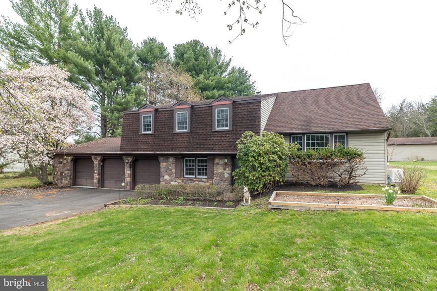 Location! Location! Location!  Great school district! Just a short distance from access to main roads, there’s a nice rural feeling and views in the neighborhood where this house is tucked in along a picturesque street in Doylestown not far from Del Val University. The curves in the road add charm and character, as does the adjacent stone barn.   The home occupies 1-1/2 acres, most of which is an open rear yard, that includes a dog pen behind the attached 3-car garages, plus a very large ramped detached storage shed with its own electric & 9 ft. garage door (owner says it can hold 2 - 23ft. boats.)
There’s a separate first floor bedroom, bath and kitchen area suite for family and friend visitors, offering potential to be turned into an in-law apartment.
In addition to a young Generac System for peace of mind, most of the house’s systems are new or young and have all been well maintained, including new gas boiler in 2025, new central air in 2024, new hot water heater in 2025, new sump pump in 2024, basement waterproofed in 2024, new water softener in 2024, and replacement windows.
This 4 bedroom home has really "good bones", and lots of flexibility with its separate guest quarters on main level and its bonus room on upper level  which can be that extra space always wanted for an art studio, exercise room, sewing room, etc.  It just needs some cosmetic TLC to make it...HOME SWEET HOME!