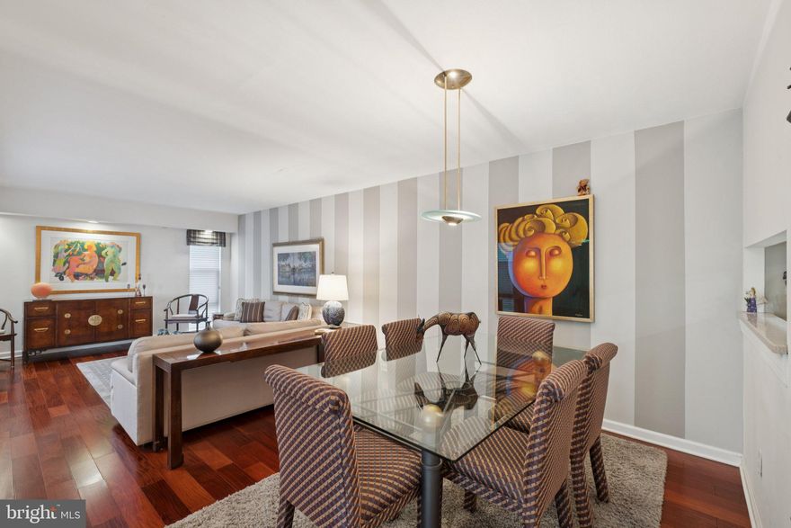 Beautifully appointed bi-level two bedroom plus den with a large deck at Penn's Landing Square! Nestled within the beautifully landscaped gardens and private courtyards of Penn's Landing Square is this lovely two bedroom plus den (can easily be converted to a three bedroom), two bathroom home with excellent entertaining space and tasteful updates throughout. Up a flight of stairs is the welcoming foyer with coat closet that leads to the open great room. The spacious great room enjoys beautiful natural light from oversized windows, accent lighting, and ample space for living and dining. Adjacent is the eat-in kitchen with light wood cabinetry, granite countertops, a full suite of appliances, pantry closet, recessed lighting, tile floor, and a passthrough overlooking the dining area. Also on this level is a large den with oversized windows and deep wall closet that could be used as a third bedroom. Adjacent is a full hall bathroom with wooden vanity and tub shower. The second floor houses the spacious primary suite with oversized window, two wall closets and updated ensuite bathroom boasting a large vanity with granite top, tub shower with designer tilework, upgraded tile floor, and a laundry closet with stacked Electrolux washer/dryer. The bathroom also has a hallway entrance. There is a second generously sized bedroom with deep wall closet and sliding door leading to the incredible rear deck. This deck is the ideal space to entertain during the warmer months, with ample space for outdoor dining and lounging, and a hose hookup for those who enjoy gardening. Additional home highlights include rich hardwood floors on the main living floor, and the stairs, recessed and accent lighting, and incredible natural light throughout. Residents enjoy the use of the heated seasonal outdoor pool with a lifeguard, community space for personal events, heat, water, sewer, basic cable, snow removal, gardening, exterior maintenance, and repairs. Located in the historical neighborhood of Society Hill, Penn's Landing Square is surrounded by museums, movies, shopping, and restaurants bordering the waterfront. Pet-friendly, some restrictions may apply.