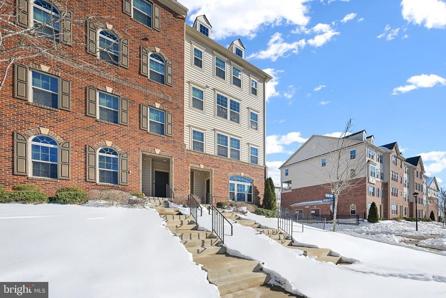Welcome home to Virginia Manor at Dulles Farms! This well-maintained townhome offers a thoughtful layout with gleaming hardwood floors and an inviting open floorplan. Inside, your kitchen impresses with sleek granite countertops, modern stainless steel appliances, a chef's pull-out faucet, and an abundance of rich wooden cabinetry. A peninsula breakfast bar opens beautifully into the dining area, which flows seamlessly into the sun-filled living room, perfect for both casual gatherings and elegant entertaining. Upstairs, the primary suite features plush carpeting, two generously sized walk-in closets, and a handsome en suite bathroom that includes a wide double sink vanity and step-in shower. Two additional bedrooms with soft carpeted flooring - one with a private balcony perfect for morning coffee - share a well-appointed hall bath. Practical conveniences include bedroom-level laundry with utility sink and dedicated cabinet storage, plus a one-car garage with rear access and additional driveway parking. Your HOA fee covers an impressive array of services including lawn care, snow removal, water, and trash, while the community itself offers an outdoor pool, tot lots, walking paths, and a community center ideal for gatherings and events. Just minutes to Harris Teeter, Giant, Dulles Town Center, One Loudoun, Dulles South Recreation Center, and Dulles Airport. Quick access to Route 50, I-66, Braddock Road, Route 15, Dulles Toll Road, and the Fairfax County Parkway. Schedule your showing today and discover the perfect blend of comfort and convenience!