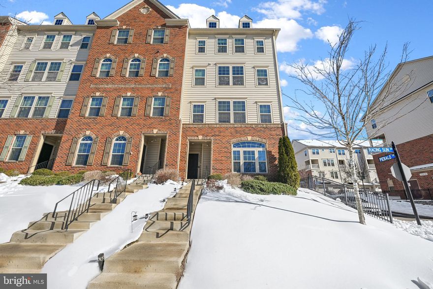 Welcome home to Virginia Manor at Dulles Farms! This well-maintained townhome offers a thoughtful layout with gleaming hardwood floors and an inviting open floorplan. Inside, your kitchen impresses with sleek granite countertops, modern stainless steel appliances, a chef's pull-out faucet, and an abundance of rich wooden cabinetry. A peninsula breakfast bar opens beautifully into the dining area, which flows seamlessly into the sun-filled living room, perfect for both casual gatherings and elegant entertaining. Upstairs, the primary suite features plush carpeting, two generously sized walk-in closets, and a handsome en suite bathroom that includes a wide double sink vanity and step-in shower. Two additional bedrooms with soft carpeted flooring - one with a private balcony perfect for morning coffee - share a well-appointed hall bath. Practical conveniences include bedroom-level laundry with utility sink and dedicated cabinet storage, plus a one-car garage with rear access and additional driveway parking. Your HOA fee covers an impressive array of services including lawn care, snow removal, water, and trash, while the community itself offers an outdoor pool, tot lots, walking paths, and a community center ideal for gatherings and events. Just minutes to Harris Teeter, Giant, Dulles Town Center, One Loudoun, Dulles South Recreation Center, and Dulles Airport. Quick access to Route 50, I-66, Braddock Road, Route 15, Dulles Toll Road, and the Fairfax County Parkway. Schedule your showing today and discover the perfect blend of comfort and convenience!