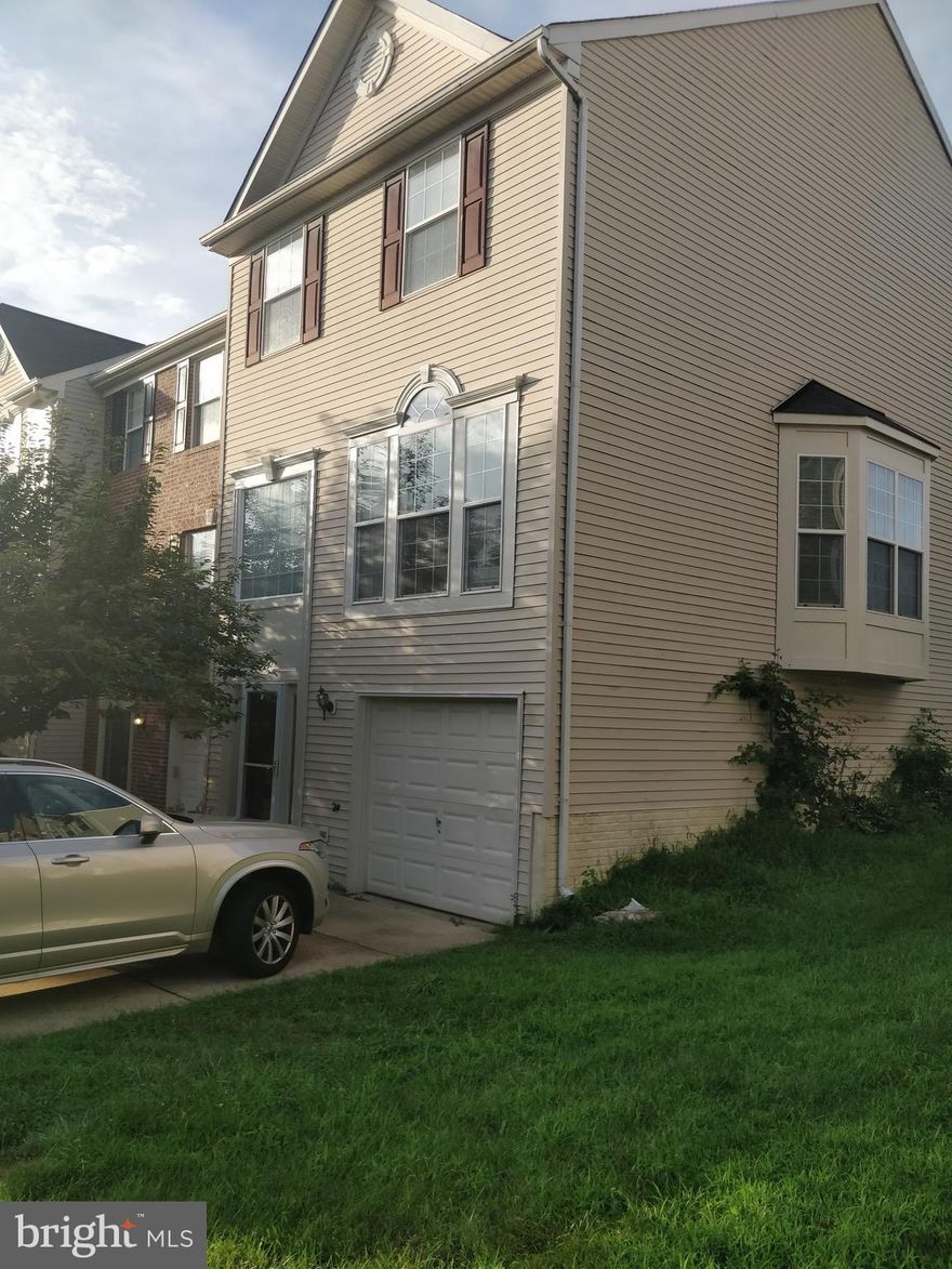 Beautiful end unit townhouse with 1 car garage. Clean, bright, and open 3 bedroom 3 bathroom with hardwoods on main level., master suite, rec room, with fenced patio and deck . Walk to the VRE station, close to shopping and parks. A must see.