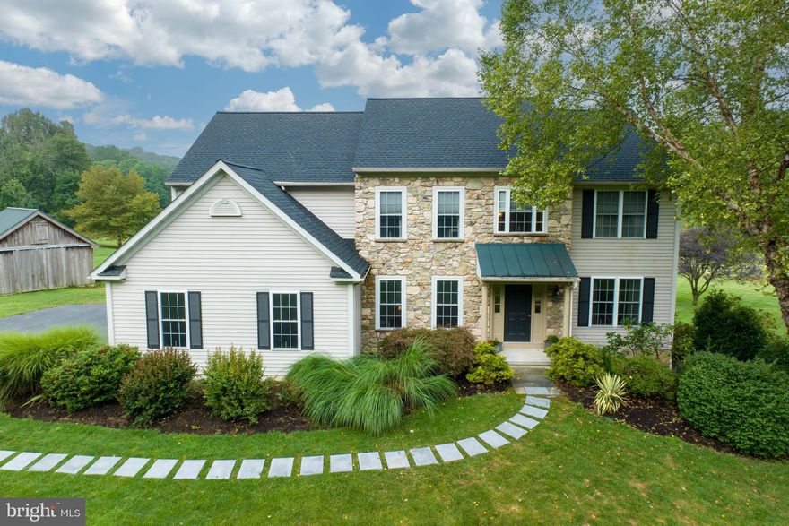 Stunning 2-story home in Honey Brook Twp. Sitting on 3+ acres this property has an updated open floor plan with traditional/rustic touches. Hardwood flooring flows through the 1st floor. The spacious kitchen has a granite center island and a 2-story eat-in area with exposed wood beams. A triple french door opening to a large deck overlooking a flat open lot surrounded by privacy shrubs and shade trees. An open family room hosts a gas fireplace and custom wooden glass doors that lead to a 1st floor office. This office has custom made cabinetry and a built-in desk. There is a split staircase leading to the 2nd floor that has a cozy comfortable sitting area. The main bedroom suite is very large with a full length walk in closet and sitting area. The main suite’s bathroom boasts a soaking tub and ceramic tile flooring. 3 other large bedrooms occupy this floor, one with hardwood flooring.  The custom light fixtures and ceiling fans give this home a custom touch. The basement is extra high with a walkout daylight sliding glass door. There is a secondary 20 x 30 structure used as a detached garage, has a cement poured floor, 2nd floor loft area and electric. Also could be used as a barn for horses. You can have livestock on this lot by year 2027 as the deed restrictions end. This beautiful 3+ acre property hosts a pond and a running stream. Propane tank is owned. New roof installed in 2023 with solar panels. NO HOA, no fees. Tractor in barn is nego.