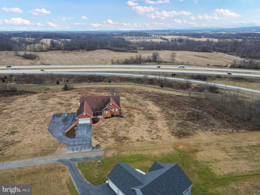 House in listing photos is a rendering of what could be.  Amazing location with easy commuter access and very light restrictions.  No mobiles.  All home must be on permanent foundations.   Multiple lots ranging from 2.17-4.3 Acres.  Lots are easy to build and all are perc'ed and ready to build.   House packages can be built into price with Henson Quality Contracting or your builder of choice.  Most lots have walk out basement options and multiple house locations.  NATURAL GAS is available in community!  Road Maintenance Agreement in place with fees to be determined by majority vote in community.