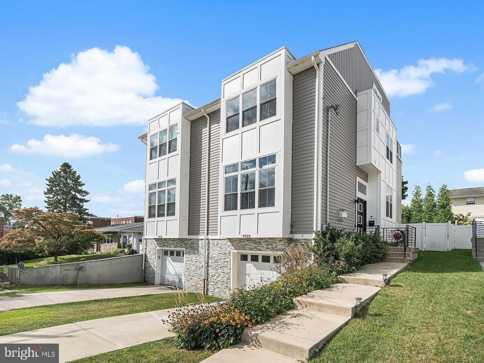 AVAILABLE NOW - Modern Luxury with a Suburban Feel & City Taxes!
Discover four floors of sophisticated living in this stunning SMART home, complete with a FULL tax abatement through August 2029. Enjoy the perfect blend of city excitement and suburban tranquility, with a beautifully landscaped yard and a 6-person hot tub providing a private oasis.
The expansive open-concept main floor boasts 10-foot ceilings, hardwood floors, and a gourmet kitchen designed for entertaining. It features professional stainless steel appliances, a Thor professional range/hood, a double wall oven, an oversized island, and a butler's pantry with a wine cooler. The living area is anchored by a gas fireplace with custom built-ins. For ultimate peace and privacy, the entire party wall has been professionally soundproofed.
Retreat to the lavish owner's suite with its elegant cathedral ceilings, spacious closets, and a spa-like shower system. This home offers three spacious bedrooms, including a lower-level guest suite and a third-floor suite that opens onto a spectacular roof deck with incredible views.
Perfectly situated for easy access to Center City, the Wissahickon trails, Manayunk's vibrant Main Street, and the boutiques of Chestnut Hill.