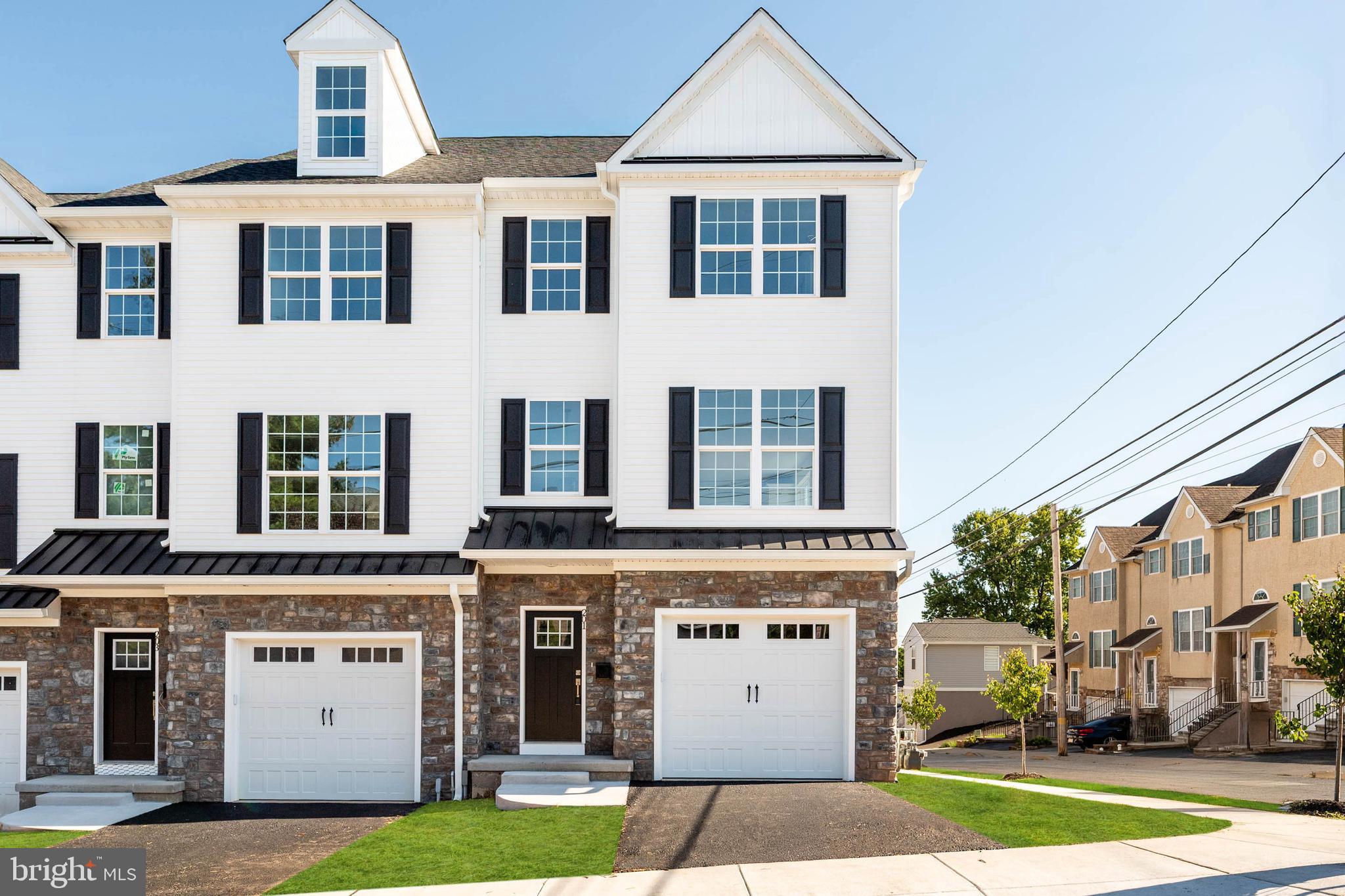 Discover the perfect blend of modern style and practical design in these brand-new construction townhomes at Bridgeview Crossing. Featuring 7 exclusive residences, choose from spacious 3- and 4-bedroom models with 2.5 bathrooms and over three levels of thoughtfully designed living space.
Step inside the home from the covered front porch to the entryway with coat closet. The main level features an open concept layout with 9-foot ceilings, luxury vinyl flooring, and plenty of natural light. Throughout the home, recessed lighting enhances the bright, modern feel. A convenient powder room and pantry add functionality to this stylish space. The gourmet kitchen serves as the heart of the home, showcasing a stunning 8 foot island, 42 inch cabinets, quartz countertops, and a suite of GE stainless steel appliances. Seamless flow from the kitchen to your private Trex deck makes entertaining easy.
Upstairs, retreat to your primary suite, complete with a walk-in closet and a spa inspired bathroom featuring dual vanities, tile flooring, and a walk-in shower with a semi-frameless glass shower door. The second bedroom is spacious with ample closet space, while the hall bathroom, linen closet, and convenient laundry area add to everyday ease. All bedrooms are wired for ceiling fans to provide added comfort and flexibility.
The top floor offers a third bedroom, perfect as a guest space, home office, or private retreat, complete with a deep storage closet for versatility.
The finished lower level expands your living space and opens to a second Trex deck, ideal for outdoor gatherings. Inside, enjoy direct access to your 1-car garage, wired and ready for your EV charger, with additional storage space. A private driveway provides added convenience.
Located in the highly regarded Upper Merion School District, and just minutes from King of Prussia, Conshohocken, major commuter routes, shopping, dining, and recreation, Bridgeview Crossing delivers ample space, modern luxury, and a truly convenient lifestyle – all with no HOA fees.
Schedule your private tour today!