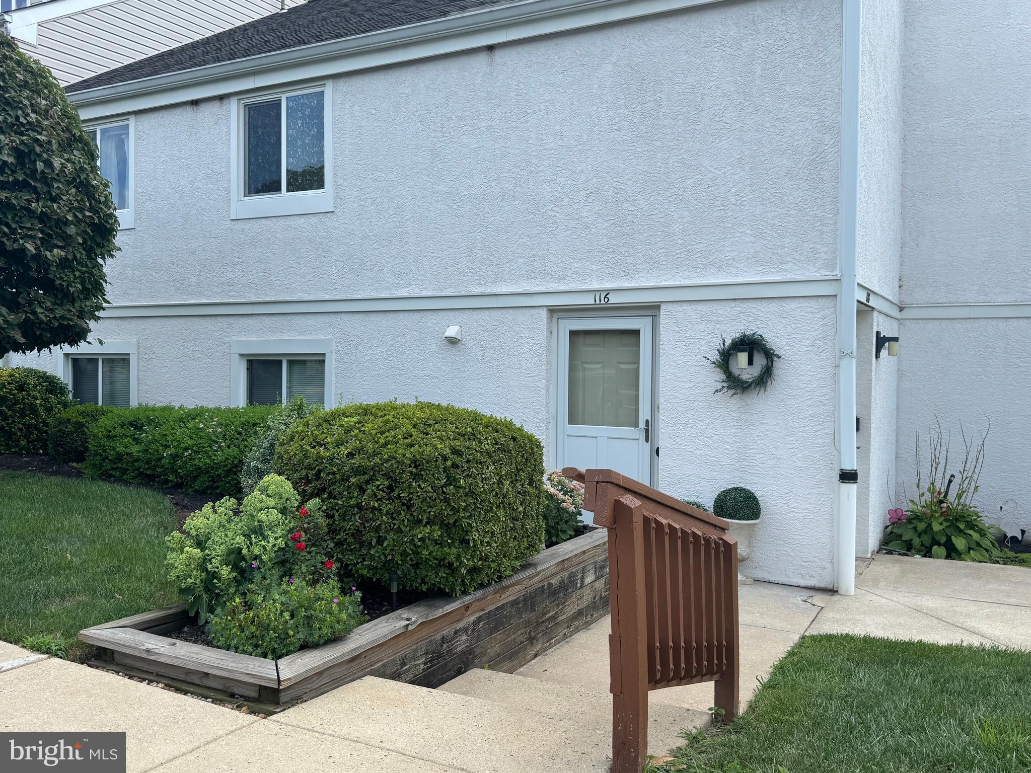 NEW PRICE! Welcome to 116 Harvest Lane in the Caines Creek Community. This fabulous condo in the Phoenixville area is ready for immediate occupancy. The condo is on the first floor and features a welcoming entrance to a large living with room wood burning fireplace, dining area, updated eat in kitchen with stainless steel appliances, generous sized Primary Bedroom with private bath and large closet, half bath for guests, and a bonus room that can be used as a possible bedroom, office, exercise, playroom, or den. Access the outdoor space from either the Kitchen or Living Room sliders to a covered patio with a lovely view. Laundry facilities are in the unit as well. Storage unit available as well. Well insulated along with a heat pump HVAC that keeps humidity low means utility expenses are low and reasonable. The community features an in ground pool as well as a Community Center (currently being renovated for future enjoyment). Two dedicated parking spots. Located in Phoenixville Boro you'll find a vibrant and growing downtown community within walking distance including fun activities, restaurants, shopping, Phoenixville hospital, and so much more close by. Easy commute to KOP, Delaware Valley, or Philly areas as well. This is an ideal opportunity to live a carefree lifestyle with so many amenities to choose from.