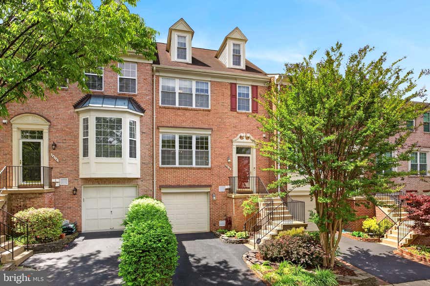 Welcome to 7412 Gillingham Row in Alexandra, VA 22315!
Rarely available 4 level Carr built Bedford model townhome with 1-car garage in the highly sought-after Kingstowne community! This immaculate brick-front home offers over 2,500 square feet of beautifully updated living space, blending timeless elegance, thoughtful upgrades, and an unbeatable location.
A grand foyer entry with soaring ceilings and transom window welcomes you inside, where hardwood flooring, crown molding, and abundant natural light set the tone throughout the main level. The expansive living room offers oversized windows and opens seamlessly to the formal dining room, creating an ideal layout for both entertaining and everyday living.

The beautifully updated kitchen features 42” cabinetry, granite countertops, stainless steel appliances, stylish backsplash, recessed lighting, and an oversized peninsula with abundant prep space and seating. A charming bay window fills the breakfast area with natural light, while the open-concept layout flows effortlessly into the adjoining family room complete with updated ceiling fan and sliding glass door access to the Trex deck. Enjoy peaceful wooded and common area views from the spacious outdoor living space, perfect for morning coffee, grilling, or evening gatherings. A beautifully updated powder room completes the main level.

Upstairs, hardwood flooring continues throughout. The expansive primary suite is a true retreat featuring vaulted ceilings, skylights, updated ceiling fan light, large walk-in closet, and a beautifully renovated spa-like bath with separate soaking tub and shower. The signature Bedford model loft on the 4th level, offers exceptional flexibility for a home office, gym, library, nursery, or private lounge space, along with an additional walk-in closet and generous storage.

Two additional upper-level bedrooms offer ceiling fan lighting, spacious closets, and share a beautifully renovated hall bath.

The deluxe walkout lower level features newer carpet, a cozy gas fireplace, powder room, and versatile recreation space ideal for movie nights, guests, gaming, or working from home. The lower-level powder room also offers future potential for conversion to a full bath.

Outdoor living continues with a lower patio and fenced yard, creating multiple spaces to relax and entertain.

Meticulously maintained and thoughtfully updated throughout, including energy-efficient windows and sliding glass doors with transferable warranty (2014), roof (2014/2015), garage door (2014), HVAC (2016), washer and dryer (2025), updated lighting and ceiling fans (2023-2026), stylish backsplash (2026), 

Perfectly tucked away on a quiet cul-de-sac, this exceptional home is just minutes to Metro, Van Dorn, I-495, shopping, dining, and all of Kingstowne’s sought-after amenities, including pools, fitness centers, tennis courts, walking trails, playgrounds, and beautifully maintained community spaces.

Location, lifestyle, and space come together beautifully in this exceptional Kingstowne home.