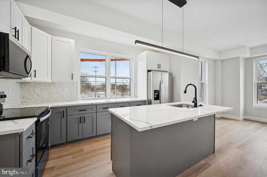 Welcome to 214 W Cumberland St, a new construction corner duplex with 10 year tax abatement. This corner property is located in hot Norris Square area and includes separate entrances for each of the bilevel 2bd/2ba units. Constructed with classic red brick and a dark blue facade paneling gives the property a strong and modern presence. Both units are bright with tons of windows for natural light, sleek kitchen and bathroom designs, oak LVP flooring, and separate outdoor spaces for each unit. The upper unit has a central kitchen with nice island, marble backsplash, huge living room, and convenient powder room. Heading upstairs there are two bedrooms, two bathrooms, laundry closet, and roof deck made with composite decking over a commercial TPO roof. The lower level is light and spacious with a large sliding door off of the living room that leads to the rear yard. The kitchen has bar seating with waterfall edge countertop, marble backsplash, stainless steel appliances, and coat closet. Heading downstairs is two bedrooms and two bathrooms as well as a laundry closet. Estimated rents are around $2000 for each unit. Perfect opportunity for house hackers to live in one unit and lease the other.