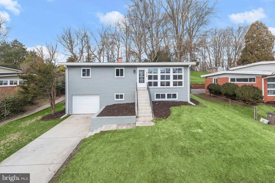 Experience the epitome of comfortable living in this rancher nestled in the heart of the Twinbrook Forest community of Rockville!  This delightful raised rancher boasts a captivating living room adorned with a vaulted ceiling and an abundance of natural light pouring through the expansive picture window. Revel in the warmth of hardwood floors that grace every corner of this inviting residence.  Entertain seamlessly in the dining room, offering a seamless flow to the patio—an ideal spot for al fresco dining or simply enjoying the outdoors. The heart of the home lies in the well-appointed eat-in kitchen, featuring granite counters, ample storage, shaker-style cabinetry, and a suite of stainless steel appliances that elevate your culinary experience.  Retreat to the primary bedroom, a haven of cool colors and a tranquil ambiance, creating a perfect sanctuary. The main level is completed by two additional bedrooms and a modern luxurious hall bath with ceramic tile and decorative accents, providing comfort and convenience for family and guests.  Descend to the lower level, where plush carpeting sets the stage for a versatile space. Discover an additional bedroom and a timeless contemporary full bath, offering flexibility for guests, a home office, or a recreation area. The convenience of a one-car garage enhances the practicality of this charming residence.  Major commuter routes include MD-97, MD-28, and I-270 for travel to points north and south. Windows throughout are updated.