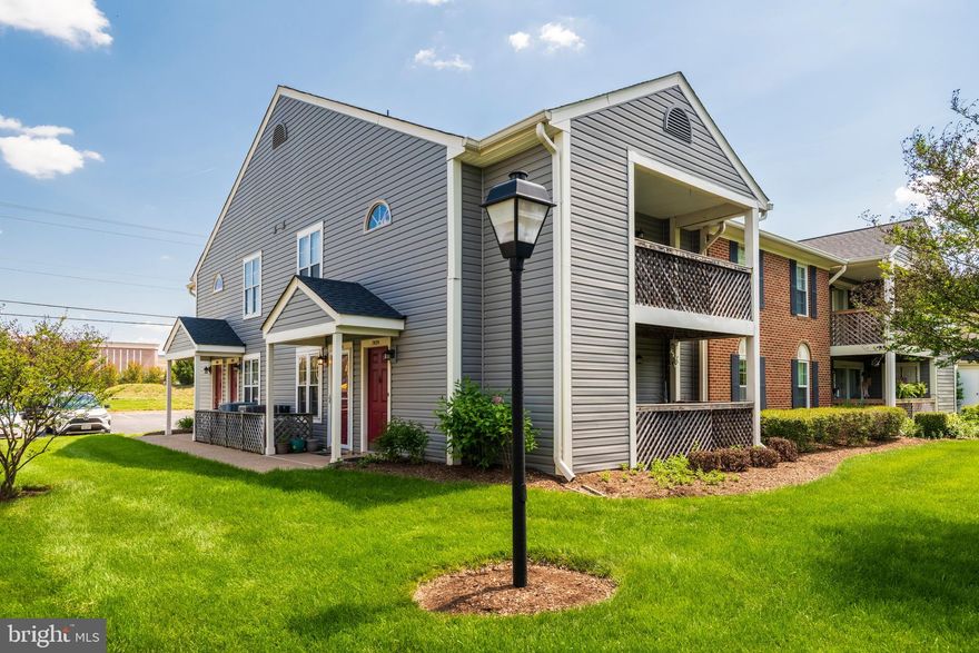 This beautifully maintained luxury condominium is ideally situated just a short walk from a variety of shopping, dining, and entertainment options. This bright, corner-unit, ground-floor home offers approximately 710 square feet of thoughtfully designed living space. The one-bedroom layout features a spacious bedroom with three closets, including a newly customized built-in closet with integrated lighting, as well as a window that fills the room with natural light. Additional storage is conveniently located in the hallway, perfect for coats and everyday essentials. The kitchen has been tastefully updated with new flooring, modern cabinetry, and a Samsung stainless steel three-tier dishwasher. A window with new blinds enhances both light and privacy, while a newly installed aluminum storm door adds comfort and energy efficiency. The laundry room includes a new Samsung smart stackable washer and dryer, along with added storage solutions for convenience. Step outside onto the large private wooden balcony—an inviting retreat overlooking lush greenery. The attached storage room has been fully renovated with multi-level wooden shelving on three sides, offering exceptional organization and functionality. Don’t miss the opportunity to tour this charming and cozy condo—schedule your visit today!
