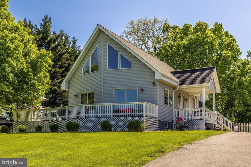 Honey stop the car!!!!! This is the one!  Amazing home on a fantastic lot.  Enter into the main living area, with vaulted ceilings and lots of windows to enjoy the sunshine and gorgeous views.  Hardwood floors though out the main level, with ceramic tile in the kitchen.  Livingroom flows directly into dining area and kitchen.  Finishing off the main level are two bedroom and a full bath.  Full bath has a custom tile shower, new vanity and tile flooring.  Upper level has an open loft over looking the main level.  Spacious loft could be used as a sitting area, office, or a kids playroom.  Mater bedroom with lots of closet space, hardwood flooring and  and a full bath.  Pull down attic stairs locater in the MBR.  Attic has a partial floor for added storage.  The basement is fully finished with plenty of space for entertaining and storage.  There is also a full bath in the basement.  The exterior of the property is an entertainers dream.  Huge wrap around deck to enjoy sunsets and to grill and chill.  Off the deck is a stone area for sitting and enjoying the firepit.  Huge rear yard is fenced in and includes a large shed.  The possibilities for this property are endless.  Housing for college students attending Shepherd University, just a few minutes away.  The property would also make an amazing Airbnb, with close proximity to the river, Shepherdstown, Harpers Ferry, Crystal Grottos, Charlestown, Boonsboro, Appalachian Trail, Antietam Battlefield, and many other historical points of interest.  The upper part of the driveway has parking for six to eight vehicles.  This one is priced to move.   Bring a pen and write the sellers an offer.