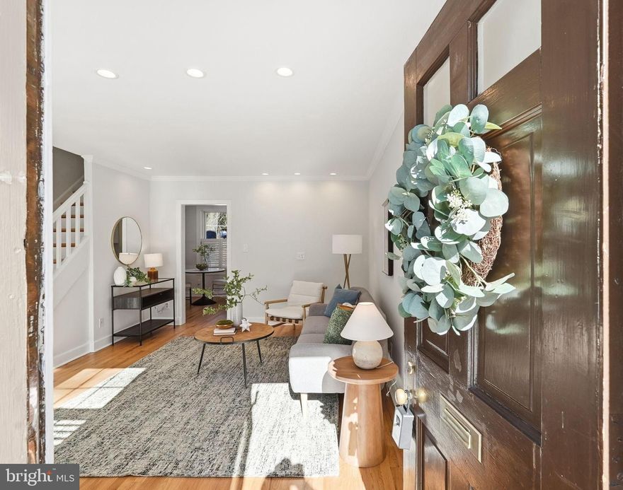 Tucked into the peaceful, wooded setting of Arlington Village, this charming townhome-style condo offers the perfect blend of historic character, thoughtful updates, and serene surroundings. Located in a quiet lower ravine overlooking lush greenery, the home welcomes you with a sunny front garden and private outdoor spaces, including a brand-new rear deck (2024) and a newly landscaped native plant garden. Inside, you’ll find hardwood floors throughout, plantation shutters, crown molding, and oversized baseboards that add warmth and style. The light-filled living room features recessed lighting and a convenient coat closet, while the beautifully renovated kitchen (2021) offers white shaker cabinetry, stone countertops, tile backsplash, upscale appliances, a Hydroviv water filtration system, and a stacked GE washer and dryer discreetly tucked into a closet and brand new hardwoods on the main floor (2026). Upstairs, the spacious bedroom includes two closets—one with built-in shelving—and a large built-in desk with excellent storage. The full bath features granite tile flooring, fully tiled walls, and classic finishes. Replacement double-pane windows provide energy efficiency and easy tilt-in cleaning. The condo fee includes all of those amenities, water, trash, sewer, parking, exterior maintenance and on-sight management. The location is exceptionally convenient: walkable to Columbia Pike with grocery stores, coffee shops, and a wide variety of restaurants, plus easy access to multiple transit options for quick trips into Arlington and DC. Quiet, historic, and well-situated, this home offers a simple, efficient layout and strong everyday livability.