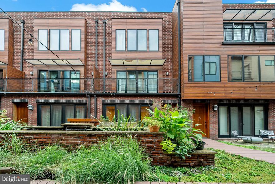 PARKING SPACE INCLUDED. Welcome to the Ice House, a LEED certified green building nestled in the heart of Fishtown.  Boasting dramatic skyline views from the rooftop terrace and dog park, to more quaint interior koi pond views from your personal patio, you have the ability to feel like you re in the city, or miles away, all at the same time. This gated modern one bedroom   one bathroom unit offers 674 square feet of open living space and includes a deeded and gated garage parking spot on the first floor of the building.  Enter the unit by walking up to the second floor open-air courtyard, encompassed by the building on almost all sides, thereby acting as a sound-wall from the outside city noises.  Scenic views of the courtyard are just the beginning as you enter into the unit through an oversized door, opening up to the living room and kitchen area, finished with dark oak hardwood floors, quartz countertops, a large island with ample seating, GE stainless steel appliances, flat panel bamboo cabinetry, a goose neck chef s faucet, modern farmhouse pendant lighting and a glass backsplash.  In addition to the main room and kitchen area, the unit includes a custom tile bathroom with a large all-glass shower complete with stone flooring, a large bedroom with ceiling fan, and a large walk-in bedroom closet.   Top this all off with high-efficiency utilities such as a tank-less water heater and a new LG stackable washer   dryer set. Get to know the area, with some of Philadelphia s finest establishments just seconds away from your front door.  Suraya, Philadelphia Magazine s #1 ranked restaurant, W. Mulherins and Sons, Fette Sau, Frankford Hall, Evil Genius Brewery, Goose Island Brewery, the Fillmore, Johnny Brenda s and many more are all just steps away! Other amenities include:  Community locked package drop, individual locking mailboxes, an electronic locking bicycle storage room, rooftop grill and bar, communal rooftop terrace and communal rooftop dog park.