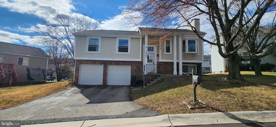 This stunning split foyer single-family home boasts two beautifully designed levels. The main level showcases a welcoming living room, a kitchen, and an inviting dining room. A hallway leads seamlessly to the bedrooms, including a master suite complete with an attached full bath. The additional bedrooms also offer convenient access to a shared full bath in the hallway, and each one features ample closet space. A charming French door next to the dining room opens onto a spacious deck, perfect for entertaining. The generously sized basement includes a cozy fireplace, a half bath, and a utility room, providing plenty of additional space. This property also includes a two-car attached garage and driveway, complemented by a beautifully level, fenced backyard that enhances your outdoor living experience.