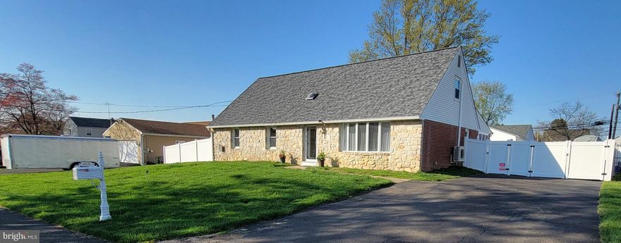 Welcome to this fully updated rancher in beautiful Bucks County—offering space, flexibility, and modern updates throughout. This move-in-ready home has been completely remodeled and truly has so much to offer. This 5 bedroom 1.5 bath home sits on a spacious 10,000 sq. ft. lot.     Step into a brand-new kitchen featuring crisp white shaker-style cabinetry that extends seamlessly into the dining area. Stunning black granite countertops anchor the space, with beautifully tiled backsplash. The space is complemented by a new refrigerator and dishwasher, along with a KitchenAid oven and microwave, all included.      The open layout allows the kitchen to flow directly into the dining area, creating an ideal setting for everyday living and entertaining.  The main level showcases hardwood floors throughout, crown molding, and a tastefully updated full bath. This level includes the primary bedroom plus two additional bedrooms, offering comfortable single-floor living.   Upstairs, you’ll find two large bedrooms with generous closet space and a shared common area between them new carpet and padding. Recessed lighting has been installed in all second-floor rooms, adding a clean, modern feel.   One of the standout features of this home is the rear brick sunporch, designed for year-round enjoyment. New windows flood the space with natural light. The porch also includes a washer and dryer for added convenience, along with a second stairwell leading to the basement. New 6-foot double doors open directly to a newly installed paver patio, perfect for outdoor entertaining.The expansive finished basement offers incredible versatility, featuring tiled floors, a large pantry, laundry room with a second set of washers and dryers and wash sink, all-new ceiling tiles, and exceptional storage space. A convenient half bath is already in place and could easily be converted to a full bathroom.    Outside, the property continues to impress. The backyard is fully enclosed with a new 6-foot white PVC fence and includes an Amish-built, barn-style 10' x 20' shed complete with custom shelving and a loft. The extended driveway, enhanced with stone beyond the double gate, provides ample parking for up to six vehicles and offers plenty of room for a boat, trailer, RV, or additional cars.     Additional highlights include:- 7 mini split units throughout the main floor, second floor and sun porch. Each has its own zone with electric heaters still in place- City water and sewer, with well water still connected- A new roof installed in 2022- Non-contracted solar panels- Real stone and brick exterior construction.  This beautifully updated stone-faced and brick home combines charm, functionality, and modern convenience—ready to welcome its next owner.