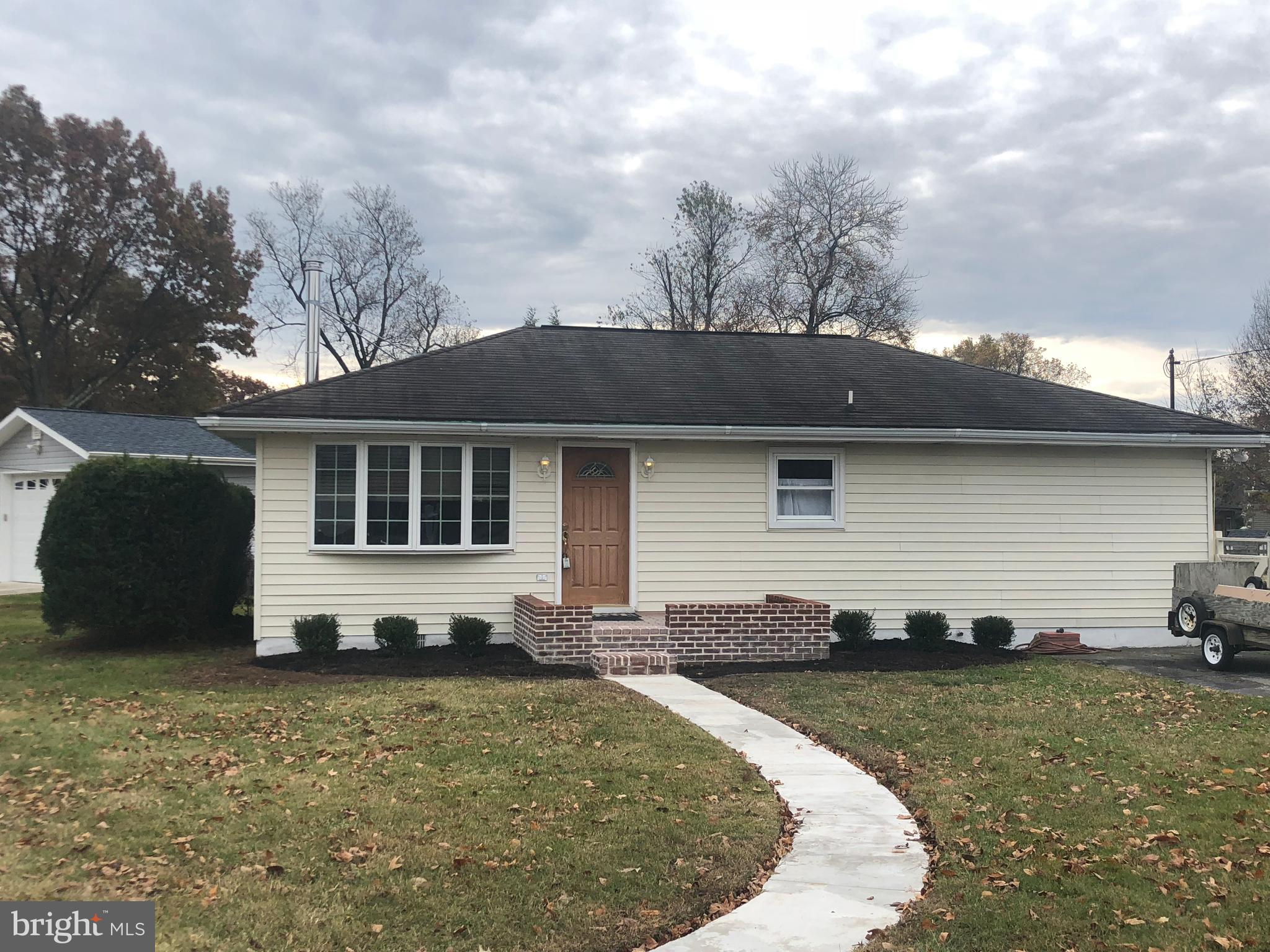 Completely renovated SFH home in water oriented community. This turnkey Rancher is situated on a flat 1/3 acre flat and fenced in backyard. Approx 1000 SQFT of renovated living space ( SQ FT on public record is inaccurate) - 2 nice sized bedrooms, 2 full baths, an open kitchen w/new cabinetry and granite counters. An adjacent family room is accented by wood stove and provides great area for entertaining. Lots of windows allow for tons of natural light! Separate utility/laundry room off kitchen. New Septic System and Water Heater w/in past 5 years.