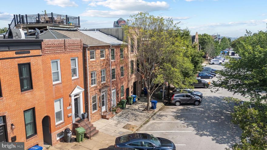 Educational Systems FCU perk: up to $2,500 toward closing costs and programs with as little as 3% down. Subject to credit approval and eligibility. -- Welcome to this exceptional three-level home located in the heart of Baltimore's vibrant Canton neighborhood. Offering 2,160 square feet of meticulously updated living space, this property perfectly blends contemporary style with historic charm. Enjoy all the modern amenities you could desire, including a gourmet kitchen equipped with stainless steel appliances, elegant granite countertops, exposed brick accents, fireplace, hardwood floors throughout, and custom lighting complemented by abundant natural light from skylights. This spacious residence boasts four bedrooms and two and a half bathrooms making it great for a family or rental income. The custom-designed staircase railing adds a sophisticated touch, leading you to an inviting roof deck, perfect for gatherings or quiet evenings, with stunning panoramic city, sunsets and water views. Situated on a charming street only three blocks from the waterfront and 1 block from Canton Square.