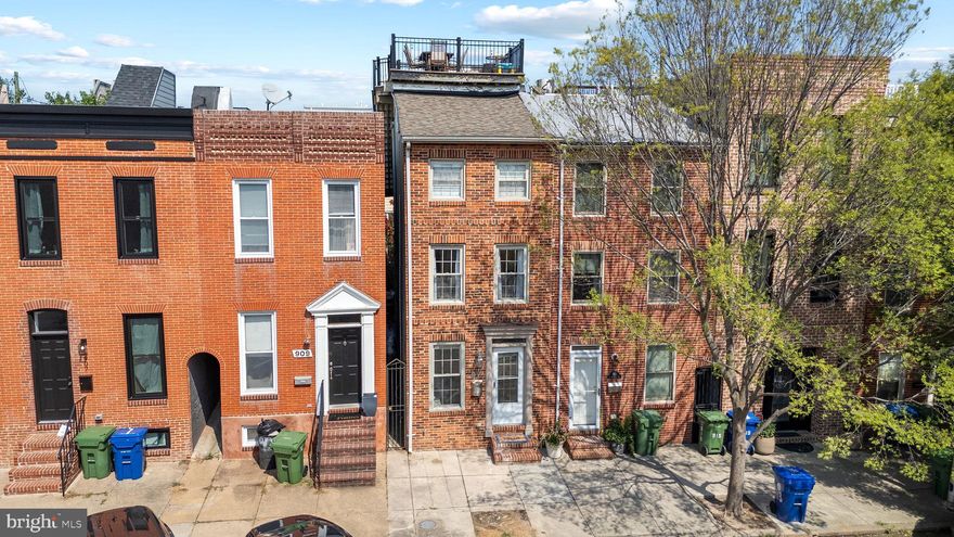 Educational Systems FCU perk: up to $2,500 toward closing costs and programs with as little as 3% down. Subject to credit approval and eligibility. -- Welcome to this exceptional three-level home located in the heart of Baltimore's vibrant Canton neighborhood. Offering 2,160 square feet of meticulously updated living space, this property perfectly blends contemporary style with historic charm. Enjoy all the modern amenities you could desire, including a gourmet kitchen equipped with stainless steel appliances, elegant granite countertops, exposed brick accents, fireplace, hardwood floors throughout, and custom lighting complemented by abundant natural light from skylights. This spacious residence boasts four bedrooms and two and a half bathrooms making it great for a family or rental income. The custom-designed staircase railing adds a sophisticated touch, leading you to an inviting roof deck, perfect for gatherings or quiet evenings, with stunning panoramic city, sunsets and water views. Situated on a charming street only three blocks from the waterfront and 1 block from Canton Square.