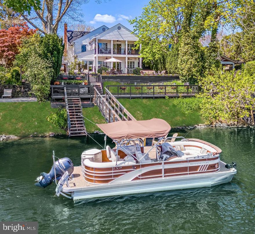 Indulge in the ultimate waterfront lifestyle at White Water Manor, an unparalleled retreat nestled in the charming village of New Hope, Pa where you can explore restaurants, shops, theater and all the nightlife the town has to offer. This meticulously renovated 4 bedroom, 3 ½ bathroom home offers sweeping views of the serene Delaware River, creating an idyllic backdrop for luxurious living. Originally built in 1935 and expanded to double its size, this residence seamlessly blends timeless elegance with modern comforts. Inside you will discover a masterfully designed interior adorned with hardwood floors, custom moldings, wainscoting and exquisite finishes throughout including custom lighting, electric shades and drapes. Enjoy the convenience of the main floor spacious office with custom built-ins. The welcoming living room is designed for both relaxation and entertainment. Here, original bookcases and fireplace infuse the room with timeless charm creating an atmosphere of refined comfort that beckons you to unwind or to enjoy your morning coffee on the delightful private side porch. The heart of the home lies in the stunning gourmet kitchen featuring natural stained custom mahogany cabinetry and soapstone countertops with a hand carved sink. High end appliances, including a Wolfe Dual Fuel 48” range, Sub-Zero refrigerator and warming drawer cater to culinary enthusiasts, while the adjacent dining area and family room provide the perfect setting for gatherings. The convenient butlers pantry has a wet bar, second Sub-Zero refrigerator and hand-made Mercer tile. A powder room and laundry complete the main floor plan. Ascend the grand staircase to the second floor, where the primary suite awaits with cathedral ceilings, private balcony overlooking the river, coffee bar and generous closet space. Indulge in the opulent spa bathroom, adorned with full surround Calacatta Gold marble, a luxurious stone jetted tub, custom stone incline double sinks, and Robern Uplift Medicine cabinets. Pamper yourself with the Brizo Sensori shower system, offering unparalleled comfort and convenience. Additional highlights of this magnificent home include a junior bedroom suite, two additional bedrooms with a shared hallway bathroom, and a full staircase leading to an unfinished attic with expansion potential. Outside the spectacular waterfront terrace beckons with multiple seating areas providing the perfect setting for entertaining or simply soaking in the breathtaking views. Launch your personal watercraft from the private boat dock and enjoy sunny days exploring the river on your boat, kayaks and paddle boards. Every detail of this waterfront oasis has been carefully curated for luxury living at its finest. Don't miss the opportunity to make this exquisite waterfront retreat your very own.