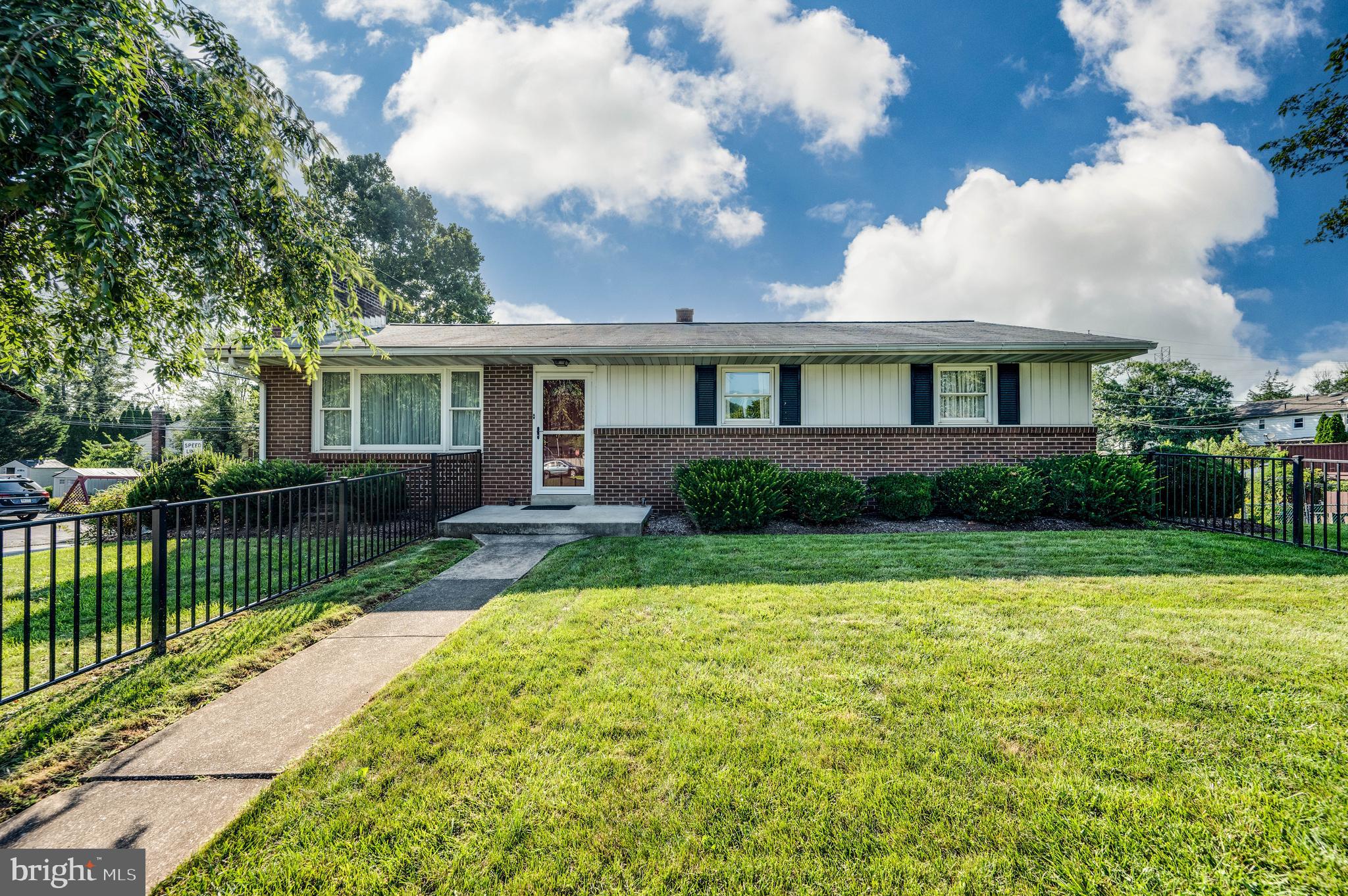 Welcome to this beautifully maintained ranch home that perfectly balances comfort and functionality. This meticulously cared-for property showcases newer windows that flood the interior with natural light, complemented by a 2018 HVAC system ensuring year-round comfort.
The spacious living room serves as the heart of the home, flowing seamlessly into a well-appointed dining room perfect for gatherings. The kitchen impresses with abundant cabinet storage and generous counter space, making meal preparation a pleasure. Hardwood floors lie beneath the current carpeting, offering future renovation potential.
Three comfortable bedrooms provide flexible living arrangements, with the primary bedroom featuring an ensuite full bathroom complete with a convenient walk-in shower. A second full bathroom offers a practical tub and shower combination for family needs.
The thoughtfully designed layout maximizes both privacy and communal living spaces. Outside, practical amenities include an oversized one-car garage providing ample storage beyond vehicle parking, plus an additional carport for extra coverage. The property is enhanced by attractive wrought iron fencing that adds both security and curb appeal.
This home represents an excellent opportunity for buyers seeking a well-maintained property with modern updates in key systems. The combination of classic ranch styling with contemporary conveniences creates an inviting atmosphere throughout. From the generous storage solutions to the multiple outdoor parking options, every detail has been considered to support comfortable daily living. The meticulous maintenance is evident in every corner, making this an exceptional choice for discerning homebuyers