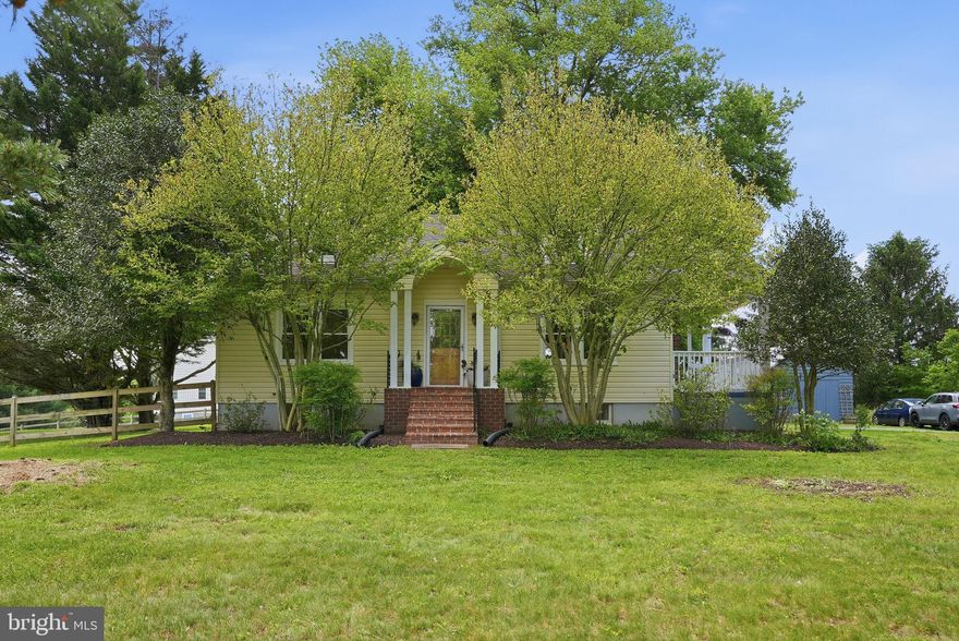 There are homes that offer space, and then there are homes that offer a feeling. Set on just under one beautifully landscaped acre, 1811 Ednor Road captures the quiet charm of a pastoral retreat, with mature trees, open green space, and a setting that feels removed from the rush of daily life. Yet for all its sense of escape, the home remains remarkably convenient to Olney, Burtonsville, Silver Spring, and major commuter routes.

Inside, the home is warm, comfortable, and thoughtfully updated, with four spacious bedrooms and three renovated full bathrooms. The main living areas are designed for both everyday ease and relaxed entertaining, anchored by a welcoming family room with a wood-burning fireplace. A separate dining room connects naturally to the family room, creating an inviting flow for gatherings, holidays, and daily living.

The updated kitchen serves as the heart of the home, featuring ceramic tile flooring, granite countertops, stainless steel appliances, a stainless steel sink, rich cherry cabinetry, and a generous breakfast bar with seating. It is a space that feels practical, polished, and well suited to both casual mornings and hosting.

The finished lower level, refreshed with brand new carpeting, provides flexible space for recreation, media, guests, work, or play. With three updated full bathrooms and a versatile layout, the home offers room to spread out while maintaining a comfortable, approachable feel.

Outdoors, the setting is one of the home’s defining features. The large fenced yard provides abundant room for entertaining, gardening, pets, play, and quiet evenings under the trees. A charming chicken coop adds to the property’s unique pastoral character, reinforcing the sense of retreat. A large storage shed adds even more storage options.

Despite its peaceful setting, the location is remarkably convenient. Nearby shopping, dining, parks, and everyday amenities are within easy reach in Olney, Burtonsville, and Silver Spring, while access to major routes makes commuting to Washington, D.C., Baltimore, Annapolis and surrounding Montgomery County communities straightforward. The result is a home that feels tucked away in the best possible sense, yet remains connected to everything that matters.

Public record reflects total square footage of 2,952. 
All measurements are approximate. Property details and square footage should be independently verified, and not used for property valuation.