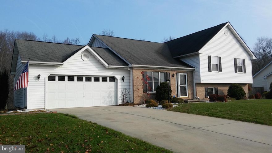 Well maintained, split level home with plenty of space!  Cathedral ceilings in living room and master bedroom, sitting room in master bedroom and large walk-in closet, double vanity in the master bath and large garden tub! Fully finished lower level with large family room, a full bath and a separate laundry room with walk-out to the back yard.  Great 1.47 acre lot backing to woods!