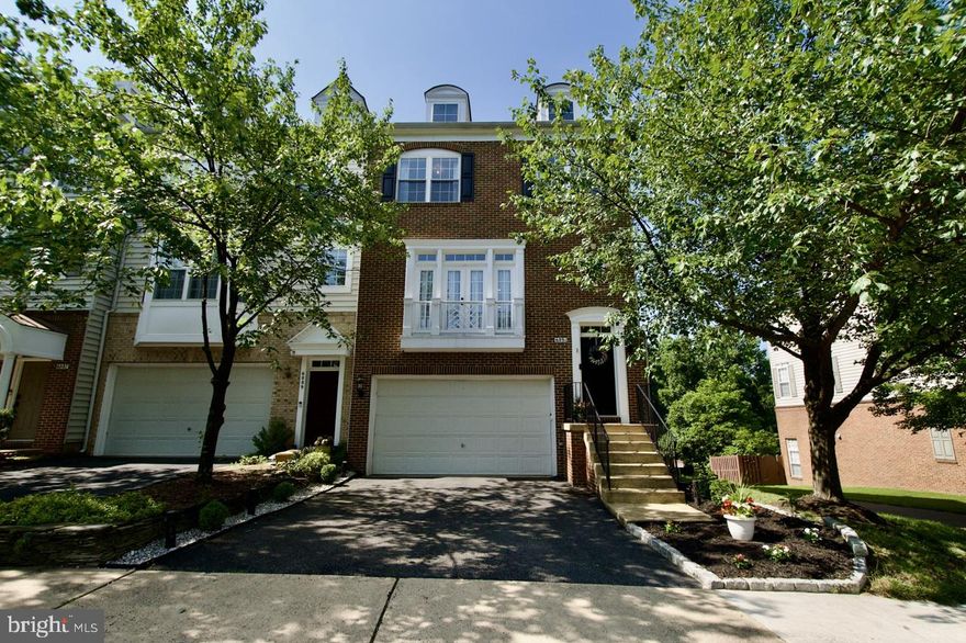 Welcome to this beautifully updated end-unit townhome featuring a 3-level bump-out for added living space (approximately 2,700 sqft) overlooking mature trees and a conservation area.  This lovely home has an open and inviting floor plan with gleaming hardwood floors, high ceilings, elegant crown molding, custom accent walls, modern light fixtures, and plenty of recessed lighting. The gourmet kitchen features 42-inch cabinets, stainless steel appliances with a new double oven stove and microwave, granite countertops, and a backsplash that adjoins a light-filled living room with French doors leading to a private Trex deck. The spacious primary suite offers a separate sitting room, tray ceiling, large custom walk-in closet, updated luxury bath with ceramic tiles, dual sinks, soaking tub, and separate shower. Two additional nicely sized bedrooms with an updated full bath and laundry complete the second level.  The fully finished lower level features a recreation room with amazing 16-foot ceilings, newly installed LVP, a gas fireplace, and a full bath. The sliding glass door leads to a private backyard with serene, wooded views. Additional highlights include a dual-zone HVAC system for personalized climate control, a large two-car garage with ample storage, an EV charger, and an outdoor shed located under the deck.  Pristine and move-in ready. Note: The current refrigerator and dishwasher do not convey and will be replaced with a different refrigerator and an LG dishwasher. Conveniently located just minutes to Ft. Belvoir, U.S. Coast Guard, two Metros, I-95/395/495, Fairfax County Pkwy, Kingstowne, Springfield Town Center, and walking distance to Wegmans and multiple restaurants.