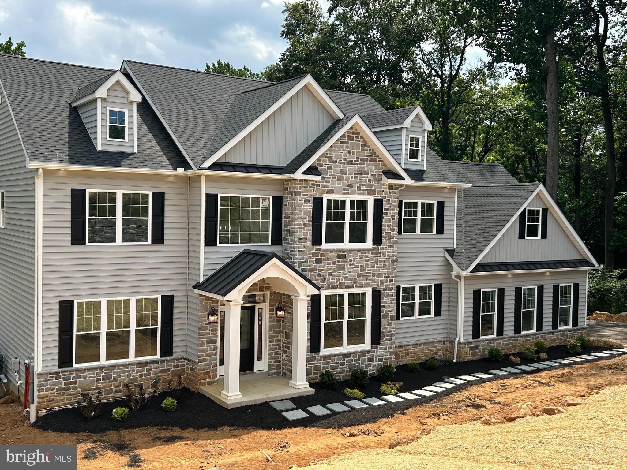 Beautiful custom home built on a .90 acre lot on a cul de sac street. If you like privacy, this is the house. A long, private driveway leads to a gorgeous, custom colonial. The views from the back are stunning; Green trees, a stream, deer, trees and nature ; just awesome . Always enjoy your solitude on one of the two super long composite decks on the main level and first floor. The decks are the length of the house and sit you up to look over all the beauty that will surround you. Totally private, tucked at the end of a cul de sac street where the other homes are at a nice distance, yet close enough to be apart of the community. Quality abounds this over 3500+ square foot colonial (may be 3700 sq.ft). Brought to you by D'Annunzio builders who have been building beautiful luxury homes in this area for many decades.-they work and live within minutes of this home. A real rarity. Enter into two story foyer complimented with beautiful mill work and immediately take in the beautiful open floor plan. Kitchen is huge and with an abundance of cabinets with a grand center island and a huge walk in pantry and prep room. Rooms are large and sunny. 9 foot ceilings on first and second floors. Gas fireplace accented in stone on first floor in the family room . Second floor consists of 4 bedrooms, 2 full baths with beautiful custom tiled bathrooms and a huge enviable walk in closet in the MBR. Laundry is conveniently located on second floor as well. You'll love the full sized basement that is ready to be finished with its 10' ceilings and comes with a plumb out for a full bathroom or the builders can finish the basement for you. This builder loves details: gorgeous fixtures, beautiful doors, stunning tile, neutral colors and flooring that will enhance all characteristics of the home. This is your house for family, fun, privacy and all that goes on in life . Square footage does not include the garage. A huge home that works for today's lifestyles. This is the very last house of the 5 new construction homes that were built. We truly saved the best for last. Another fabulous thing is that there is NO HOA! Live your best life on your terms. Get this house now! Home is located in Garnet Valley School District, near major shopping, fabulous dining and close to 95 and Phila. airport. Access through O'Day Lane. This home is completed and ready for move in. A real stunner. Pictures coming. Please read agent remarks.