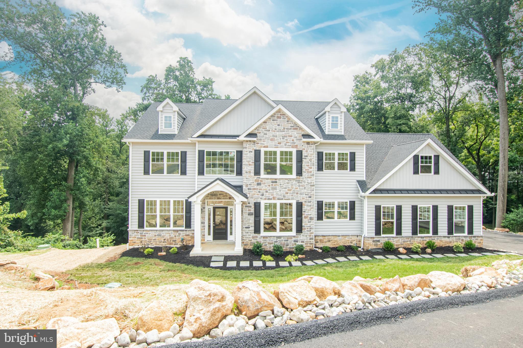 Just added: FREE FINISHED BASEMENT INCLUDED!!!!Beautiful custom home built on a .90 acre lot on a cul de sac street. If you like privacy, this is the house. A long, private driveway leads to a gorgeous, custom colonial. The views from the back are stunning; Green trees, a stream, deer, trees and nature ; just awesome . Always enjoy your solitude on one of the two super long composite decks on the main level and first floor. The decks are the length of the house and sit you up to look over all the beauty that will surround you. Totally private, tucked at the end of a cul de sac street where the other homes are at a nice distance, yet close enough to be apart of the community. Quality abounds this over 5550 square foot colonial (3750 sq.ft. first and second floor). Brought to you by D'Annunzio builders who have been building beautiful luxury homes in this area for many decades.-they work and live within minutes of this home. A real rarity. Enter into two story foyer complimented with beautiful mill work and immediately take in the beautiful open floor plan. Kitchen is huge and with an abundance of cabinets with a grand center island and a huge walk in pantry and prep room. Rooms are large and sunny. 9 foot ceilings on first and second floors. Gas fireplace accented in stone on first floor in the family room . Second floor consists of 4 bedrooms, 2 full baths with beautiful custom tiled bathrooms and a huge enviable walk in closet in the MBR. Laundry is conveniently located on second floor as well. You'll get a bonus finished basement with 10' ceilings that comes with a large full bathroom. This builder loves details: gorgeous fixtures, beautiful doors, stunning tile, neutral colors and flooring that will enhance all characteristics of the home. This is your house for family, fun, privacy and all that goes on in life . Square footage does not include the garage. A huge home that works for today's lifestyles. This is the very last house of the 5 new construction homes that were built. We truly saved the best for last. Another fabulous thing is that there is NO HOA! Live your best life on your terms. This home boast gorgeous landscaping walls, stone and unlike other new construction-includes 740 square foot in composite decking which is INCLUDED. Most new construction doesn't come with any decks. Get this house now, so many bonuses! Home is located in Garnet Valley School District, near major shopping, fabulous dining and close to 95 and Phila. airport. Access through O'Day Lane. This home is completed and ready for move in. A real stunner. Please read agent remarks.