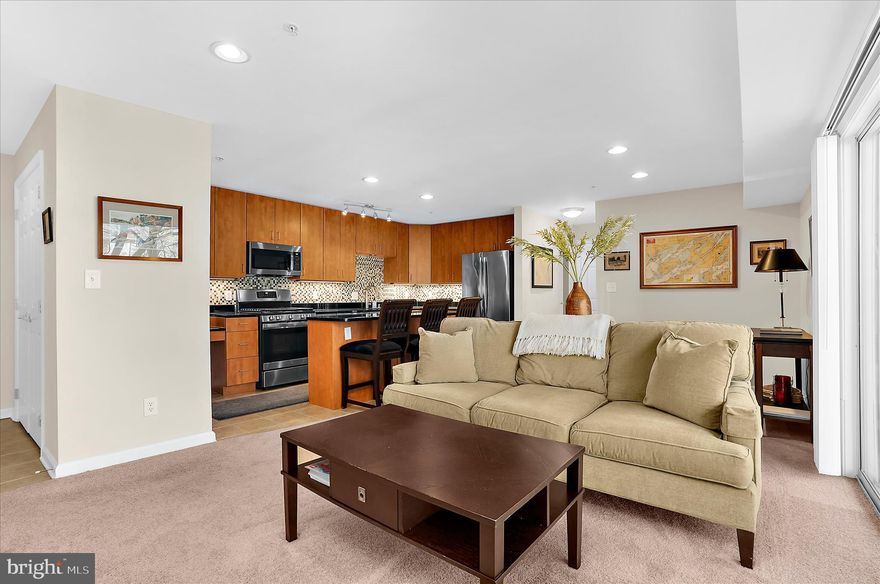 Price Improvement! Welcome to 1113 Primrose Court #204 in the ultra convenient community of The Landing at Spa Creek! Step into a recently refreshed building with secure keypad entry and head up to this spacious second floor, 2 bedroom, 1 bath condo. Inside, you’ll be delighted by the light filled living room and open floor plan, perfect for everyday living and entertaining. The updated kitchen features a large island, stylish backsplash, and stainless steel appliances, with plenty of room for a dining area. Just off the living room, enjoy your private balcony, an ideal spot for morning coffee or evening relaxation. The primary bedroom offers generous space and ample closet storage, while the second bedroom works beautifully for guests, a home office, or flex space. A tastefully updated hall bathroom serves the home. Storage is easy with a coat closet, two additional hall closets, and a dedicated storage locker in the building's basement. Parking is simple with an assigned space conveniently located near the unit, plus guest parking on the side of the building. The HVAC system was replaced approximately two years ago, and water and gas are included in the condo fee. Residents of The Landing at Spa Creek enjoy fantastic amenities, including a community pool, clubhouse, fitness center, and a public boat ramp at the end of Primrose Drive. The location is hard to beat, walkable to Truxtun Park, tennis and pickleball courts, and the Pip Moyer Recreation Center, and just a short bike ride to historic downtown Annapolis. Commuting is easy with quick access to USNA, NSA Annapolis, Fort Meade, Baltimore, Washington D.C., and BWI Airport. Schedule your showing today and experience easy Annapolis living!