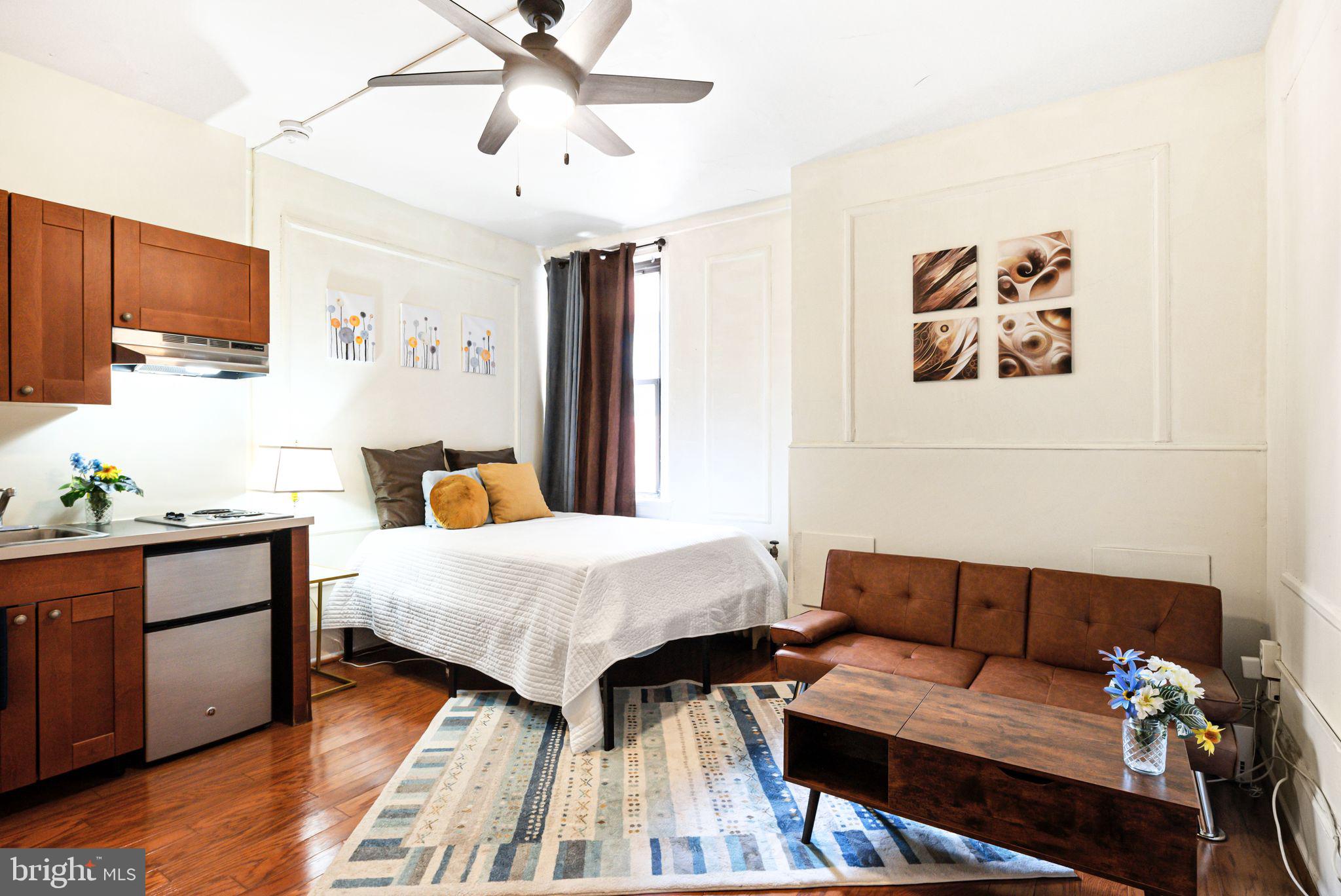 Amazing location. Cute studio apartment in the Avenue of the Arts neighborhood, where everyday essentials are within walking distance, and public transportation is right at your doorstep. Beautiful hardwood floors. The kitchen area includes a stovetop, mini-fridge, and a stainless steel sink. A spacious closet adjacent to the kitchen provides additional storage. The bathroom floor boasts classic black and white vintage tiling. High-speed internet, provided by Comcast, is included throughout the building. The building offers a fitness center, WiFi, a stunning marble lobby with a front desk, and package delivery services. Additional amenities include laundry facilities, a 24/7 front desk attendant, and an on-site salon/barbershop. Conveniently located minutes from the PATCO Eastbound to Lindenwold and Westbound to Philadelphia at the 12-13th and Locust stop, this home sits in the vibrant Avenue of the Arts South neighborhood. Nearby parks include Julian Abele Park, Seger Playground, and 1705 Rodman St. Park. With a Walk Score of 100, Transit Score of 100, and Bike Score of 89, this location offers unmatched accessibility.
