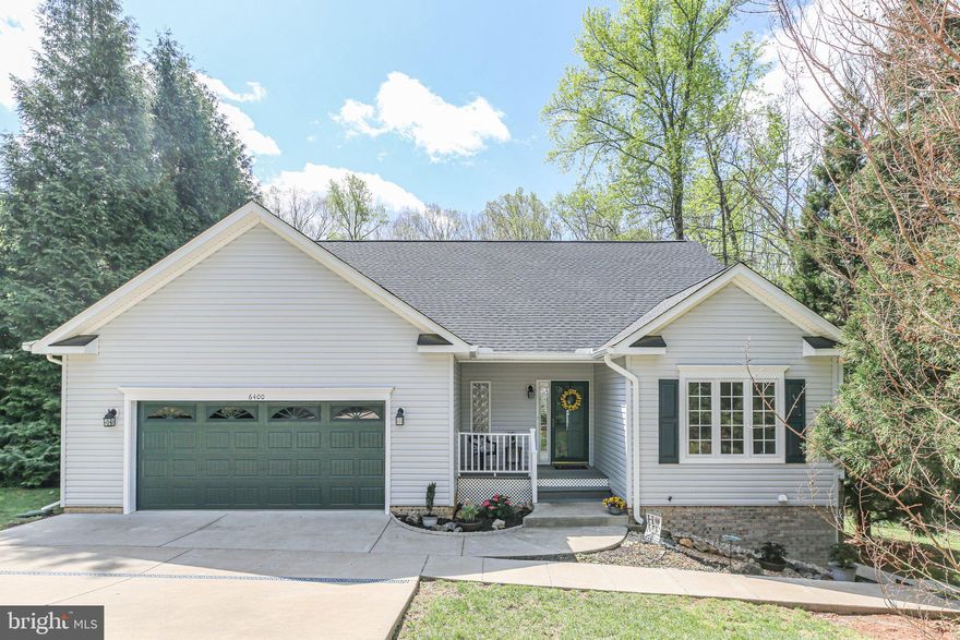 This charming, VERSATILE, 2700+ sq ft home on a 0.35 ac corner lot belongs on your MUST SEE list! Custom-designed with a split bedroom floorplan, this lovely home can work as 2 primary suites - primary bedroom with en suite bath; secondary bedroom, den (no closet), and hall bath, all enclosed behind French doors off the foyer - a 3-bedroom home, utilizing the den that also has separate outside access, or even a 4-bedroom home, utilizing the additional room and bath in the basement!  SO MANY POSSIBILITIES!  On approach to the property, situated at the front corner of a cul-de-sac, with large, mature evergreens for privacy, you'll appreciate the neat, clean, curb appeal, BRAND NEW ROOF, and welcoming Trex porch. The gleaming hardwood floors, high ceilings, freshly painted rooms, and cheerful, well-lit open space greet you, with French doors just off the foyer leading to a newly carpeted bedroom, full bath with new anti-slip Italian porcelain tile, and additional carpeted bedroom or den. An open floor plan features a bump-out for the dining area, kitchen with granite counters, bamboo flooring and breakfast island, and a spacious living room with a door leading to a BRAND NEW  covered Trex balcony. Another set of French doors lead to your laundry area with full sized stacked washer & dryer, and the 1st of 2 laundry sinks. At the back of the house, facing large evergreens for privacy, is the primary bedroom with a full wall of closet space, an en suite bathroom featuring the same anti-slip Italian porcelain tile, and lots of extra cabinet space. Access to the oversized garage, with storage shelves & attic access, is gained from this side of the house.  The basement stairs lead to an anteroom, also freshly painted and newly carpeted, offering shelving for books and collections, and even a "secret" door under the stairs for additional storage. (The Seller added a cat door for her feline friend to have her own private space!) A HUGE bathroom - where the Seller had room for a plug-in hot tub  (removed for sale) is adjacent to a bonus room that was used as guest quarters and would make a nice 3rd or 4th bedroom (no closet), exercise or play room, or any number of other creative uses. But the magic is found when you step beyond the anteroom, through the French doors, into a MASSIVE open space, previously used as a crafter's HEAVEN! Naturally well-lit throughout, and complete with an Owens Corning Basement Wall Finishing System, this versatile space could become most anything you can dream up! Rec room, theatre room, extra bedroom ... what do YOU want?  And if that's not enough, you'll still find a big storage room with steel shelves (most were disassembled for water panel access) to store all your Costco stash, a closet with sump pump, and a large utility room with easy access to the furnace/humidifier/air cleaner, hot water heater with new expansion tank and gauge, and the 2nd laundry/utility sink!  ALL OF THIS, and this one-owner home is in a small, well-maintained, well-established neighborhood, near schools, shopping, parks, library, county convenience center, and with easy access to both Rts 1 & 3, and I-95.  HAVE YOU MADE YOUR SHOWING APPOINTMENT YET? You're going to want to see this move-in ready home and make it your own! *** BEST & FINAL OFFERS DUE TO LA BY TUESDAY, 4/15 AT 7PM ***