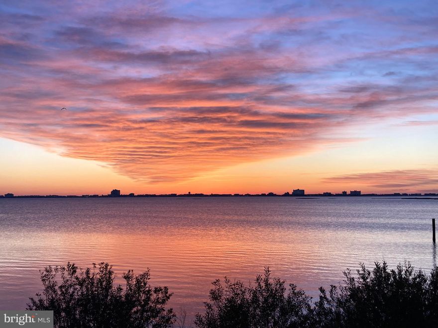 Bayfront Luxury with Breathtaking Water Views! Discover the perfect blend of comfort and coastal elegance in this beautifully maintained waterfront condo. With unobstructed views of the bay  and sparkling reflections of lights across the water, this property offers the best of waterfront living! The open, light-filled floor plan includes a spacious kitchen with a large pantry, perfect for preparing meals while entertaining. The waterfront primary suite is a true retreat, featuring two walk-in closets and a beautiful private bath with double sinks and marble flooring. Additional highlights include a cozy gas fireplace for chilly nights, a separate laundry room, and a convenient storage area for all your beach gear. Step outside to your private balcony, finished in marble and complete with a built-in grill—ideal for enjoying morning coffee, evening cookouts, and spectacular sunrises  over the bay. Located in one of Ocean Pines’ most desirable communities, you’ll also enjoy amenities including a marina, pools, golf, racquet sports and scenic walking trails—bringing together relaxation, recreation, and convenience. Don’t miss this exceptional opportunity to own a waterfront retreat!