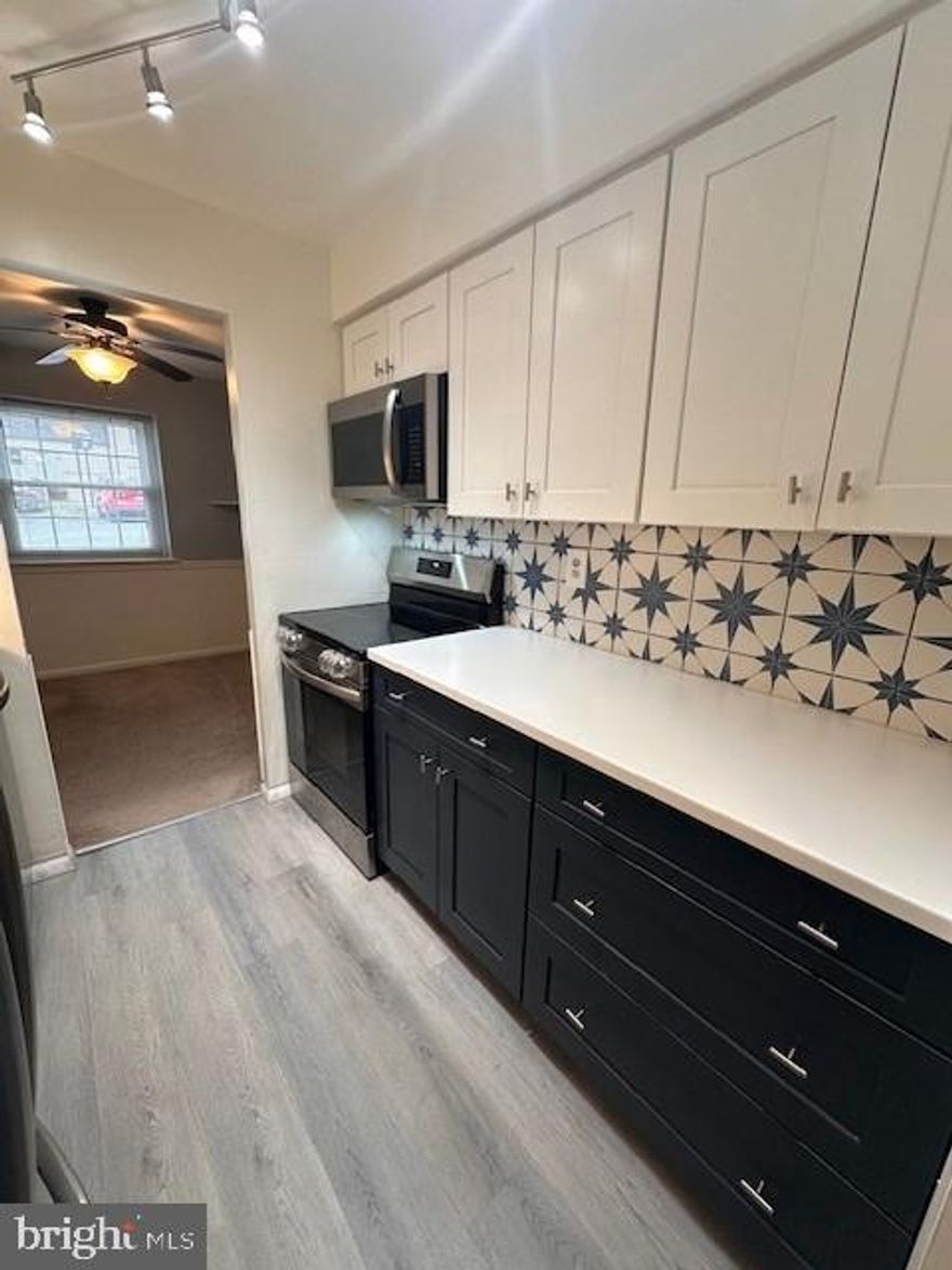 Welcome to 2703 Eagle Road in Goshen Valley, a nicely upgraded 2-bedroom, ground-floor condo with no steps for easy living. The updated kitchen features LVP flooring, stainless steel appliances, a built-in microwave, Corian countertops, upgraded cabinetry, and a tiled backsplash.  The open and bright layout includes a dedicated dining area, spacious living room, and two generously sized bedrooms with plush carpeting. The updated bathroom offers ceramic tile flooring, an updated vanity with Corian countertop, and a front-load washer and dryer. Enjoy comfortable, low-maintenance living in a well-maintained community close to shopping, dining, and major routes.