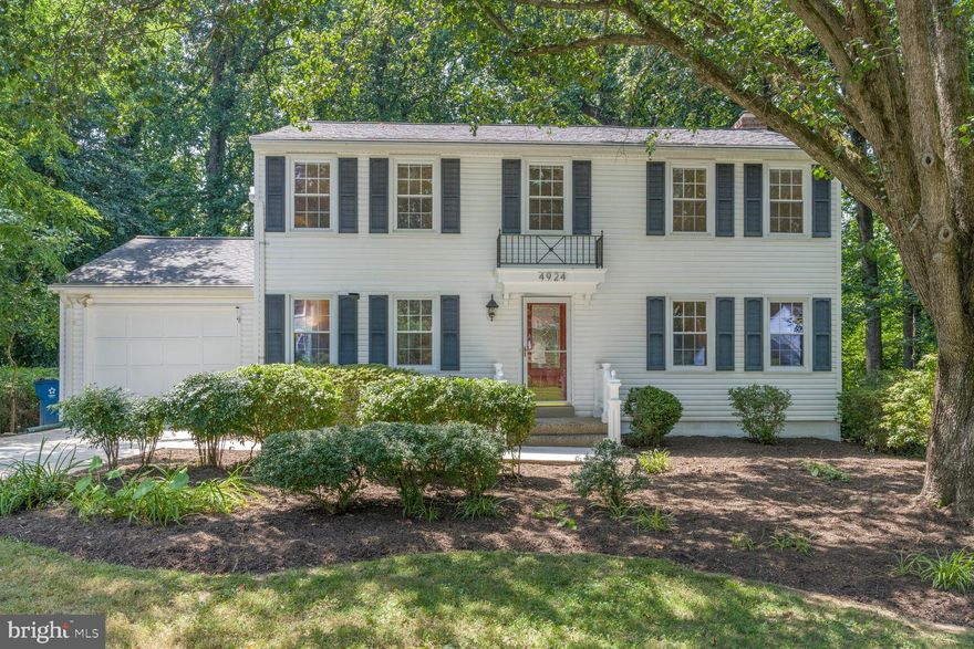 Welcome to this timeless center-hall colonial, nestled on a beautifully treed lot that backs to serene common space. Located in the desirable Bradford neighborhood and within the Woodson High School district, this home offers both charm and convenience.
As you approach the property, you’ll be greeted by the recently replaced concrete driveway, a brand-new roof, and a freshly painted entrance portico. Step inside, and the warmth of this home immediately welcomes you. The entire interior has been freshly painted, and new carpeting has been installed across all three levels.
The heart of the home is the spacious family room addition, featuring a soaring cathedral ceiling, transom windows, and large picture windows that flood the space with natural light and stunning views. A cozy wood-burning fireplace and custom built-in shelving make this room an inviting space to relax and unwind.
Both the family room and kitchen open to a freshly painted, multi-tiered deck that leads down to a shaded, fenced backyard bordered by woods, providing a peaceful retreat. The updated kitchen features modern appliances, 42” cabinetry, recessed lighting, and ample space for casual dining.
Adjacent to the kitchen, you’ll find the freshly painted garage with durable epoxy flooring. A beautifully updated powder room with custom wood-paneled walls adds a touch of elegance to the main floor, along with spacious formal living and dining rooms—perfect for entertaining.
Upstairs, the expansive primary suite easily accommodates large furniture and includes a walk-in closet with custom built-in shelving for optimal organization. Three additional generously sized bedrooms offer plenty of space for family members or guests.
The lower level provides a perfect recreational space with a walkout to a private lower deck/patio. The wet bar with space for a small refrigerator and a convenient third full bath make this area ideal for both relaxation and entertaining. Additionally, the large storage/utility/laundry room offers plenty of space for organization.
This home combines timeless appeal, thoughtful updates, and an unbeatable location just off Braddock Rd and close to Fairfax City.  Welcome home.