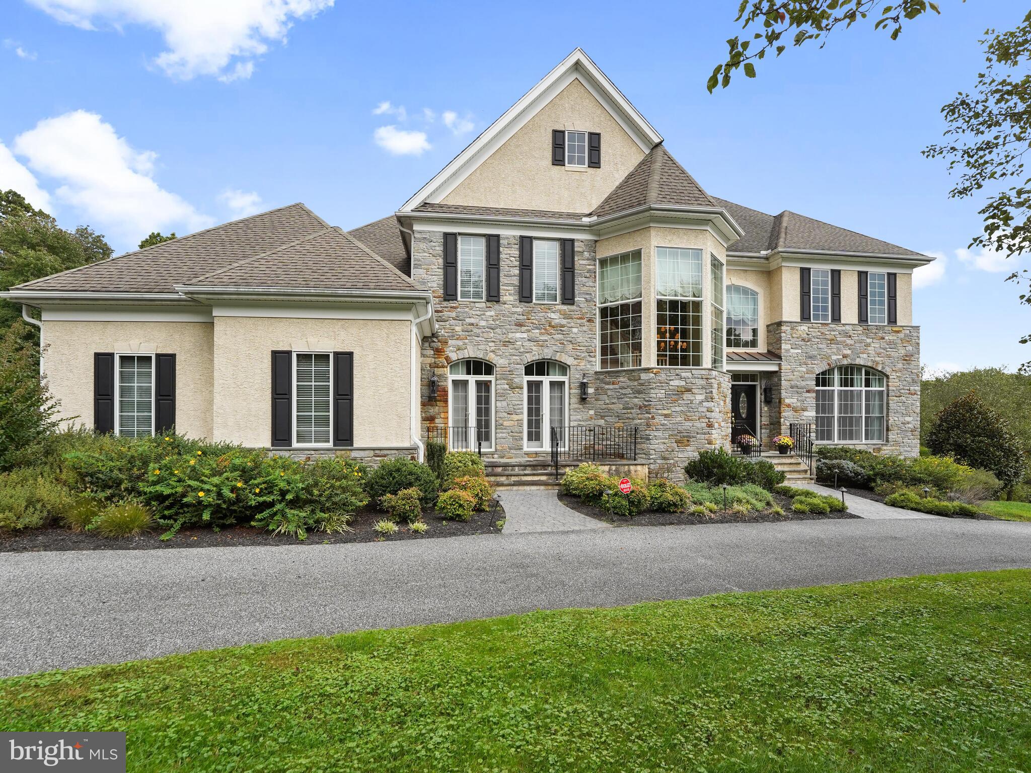Space and elegance take on a whole new meaning in this splendid custom designed home. From the moment you open the front door of this amazing home, you will fall in love and need to take a moment to catch your breath! Impressive high-end features include custom deluxe millwork, a Wine Cellar, spacious eight seat Theater Room, dedicated Billiards Room and a dramatic two story Family Room with coffered ceiling and a wall of windows overlooking the beauty of Tyler Arboretum. There is a grand two story Entrance, filled with natural light, which is flanked by a Formal Living Room with gas burning fireplace and Formal Dining Room with raised panel wainscoting and French doors which open to the garden. There is a handsome Butler's Pantry with wood cabinets, beverage refrigerator and wine storage racks. All of these exceptional spaces provide an ideal arrangement for elegant entertaining. The exceptional Family Room is warmed by a double sided gas fireplace which is shared with the Kitchen --a chef's delight. There is a large granite topped dining island with seating for six, a six burner gas cooktop, double ovens, a warming drawer and amazing workspace. There is ample space in the Kitchen for both a casual dining table and a sitting room--both of which can be enjoyed fireside. Work will be a pleasure in your substantial Home Office with tray ceiling where you can enjoy complete privacy by closing the French doors to the Hall. The Primary Bedroom Suite is an oasis for relaxation with wall-to-wall carpeting, Dressing Room or Exercise Area and private access to the Deck to enjoy morning coffee or tea. The Primary Bathroom features separate dual sinks and vanities, jetted Jacuzzi tub, large walk-in shower with side jets, overhead rain showerhead and a private water closet. Upstairs there are four substantial bedrooms, two are en suite and two share a cleverly designed Bath with each Bedroom enjoying their own private vanities with sinks. The spectacular Lower Level will dazzle you and your guests and provides space to enjoy special times with family or friends in a casual setting--with the convenience of a fully equipped Kitchen with granite countertops. This level continues to provide substantial space with two fabulous Workout Rooms where you can delight in your fitness and self care routine each day. This area also provides the flexibility to utilize the second workout room as a sixth Bedroom with access to the Full Bathroom--perhaps for an in-law or au pair. Additional features are a three car garage, wired sound system, security system and a whole house generator. This exceptional home offers everything you need to enjoy life every day and also to entertain with grace and style. Located in beautiful Middletown Township, with its lush natural beauty--yet close by to major routes, Center City, Philadelphia Airport and the wonderful offerings of both Media and the Main Line. Co-list Agent is related to Seller.