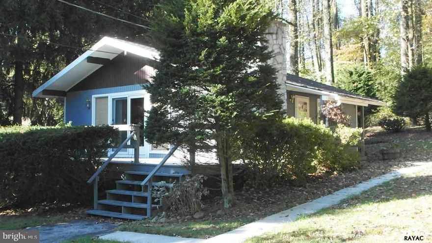 Cozy and comfortable home on a peaceful .6 acre lot in Carroll Valley.  Stone fireplace, vaulted ceiling, wood floors and a huge wrap-around deck.  Recent updates make this a low maintenance, affordable year round home or weekend getaway.  Very nice lot on a low traffic street.