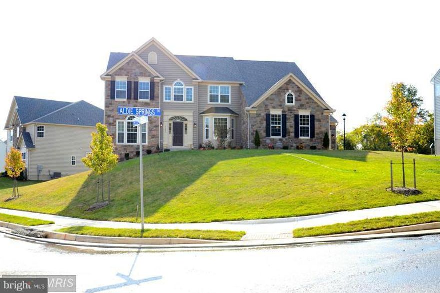 BEAUTIFUL Drees Home, One the most beautiful lots. Stone front 3 car garage,4 bedrooms and 3 full baths on upper level! Designer Gourmet Kitchen with Island. Two story family room and foyer, a must see.