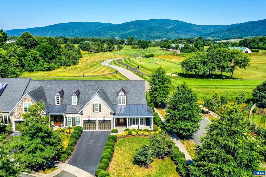 Updated and even better than before!  Fabulous low maintenance golf villa overlooking the golf course and Blue Ridge mountains! You'll love the sophisticated finishes, open, large light filled living spaces and beautiful millwork of this Craig Builders Home in Old Trail. Located on one of the best lots in the neighborhood with incredible mountain and golf course views. As you enter the home, the study/dining room to your right features built-in shelving and double desk, tray ceiling, and high-end berber carpeting. Work from home or entertain in this light-filled space. Chef's kitchen features fresh white cabinets, granite counters, stainless appliances, breakfast bar and butler's pantry. Enjoy casual meals in the large breakfast nook. The spacious great room with gas fireplace features a wall of windows overlooking the first tee of the Old Trail Golf Course.  Private main floor owners suite with spa-like bath features soaking tub, frameless glass shower and walk-in closet. Upstairs, guests will love the large suite with private bathroom and two additional bedrooms that share a full hall bathroom.  Unfinished utility room offers great storage space. It's an easy walk to golf, restaurants, and schools!,Granite Counter,Wood Cabinets,Fireplace in Great Room