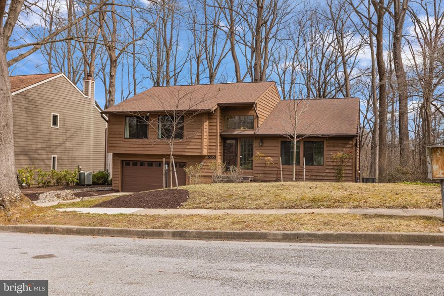 OPEN HOUSE CANCELED. Offer accepted. Thanks for the high level of interest. A rare premium lot perched high above the Little Patuxent River valley awaits you! This tranquil vacation feeling can be yours year-round on Blue Sea Drive.  Immerse yourself in the adjacent 40 acres of wooded Columbia parkland or simply explore the paved pathways and play areas along the way.  This easy-living beauty is one of Allan Homes most versatile designs at a great price, in a strategic yet quiet location, with sleek styling, beautiful natural light and soaring ceilings. Inside you'll discover a warm, naturally lit and dramatic entry with fresh tile flooring, stained glass for privacy and a large living room with a stunning two-story vaulted ceiling. The broad, elevated deck spans the width of the home and is accessed from the family, dining room, kitchen and primary suite.  Here is your chance to show off your skills in the brand-new custom kitchen upgraded with crown molding, stainless appliances and striking LVP flooring. The main living level includes three generous bedrooms and two full baths with transition-free access to the kitchen, family and dining rooms. The full daylight lower level opens to the second deck that overlooks this amazing, generous fenced yard. There is a handy storage shed and a hot tub rough-in tucked behind the house.  The open, full daylight lower level is spacious and fully finished with a second family room and large fourth bedroom, a third full bath, storage room, a hidden storage or play area, plus laundry and easy mudroom access to the oversized two-car garage. This garage is great because it has a storage area for your toys or tools. Many possibilities exist for those seeking versatility and quality. The property is clean and nicely maintained with a helpful contact file for future homeowner reference.  Additional but important updates include insulated replacement windows, the insulated front door, front storm door, updated baths, lighting fixtures throughout, major systems, HVAC 2019, six-inch gutters/downspouts, exterior front entrance stairs, insulated garage door, and a toasty wood pellet fireplace that warms the place up fast. Low energy bills will make you happy for years to come.