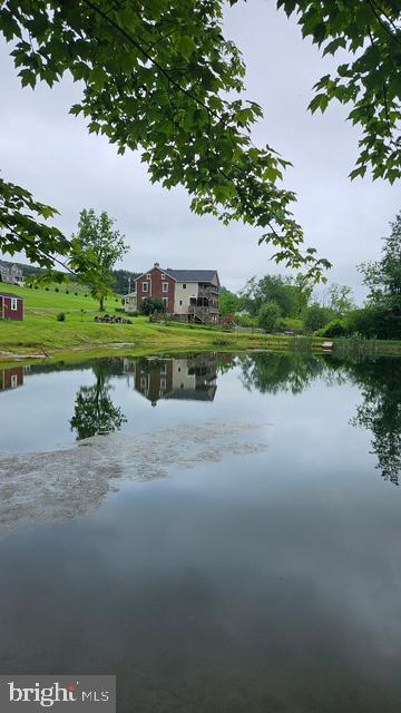 BRING THE ANIMALS ***Nestled in charming Bachman Overlook, this delightful 4-bedroom, 3-bathroom farmhouse offers a perfect blend of comfort and character. Built in 1863...The home features modern amenities like an oversized garage built in the early 2000s, central air added in 2019, and a large owner's suite with a walk-in closet built in 2019. It'a timeless Colonial architecture with modern conveniences, invites you to experience a warm, welcoming atmosphere. Set on an expansive 7.86-acre lot, the property features a barn, perfect for hobbies or storage. The property is a haven for outdoor enthusiasts, with a stream and pond with floating dock, as well as nearby parks offering trails, picnic areas, and playgrounds. The pond and surroundign landscape offers the perfect place for enjoying the beauty of nature. With ample parking, including a side-entry garage and driveway space for six, convenience is at your fingertips. This home is not just a place to live; it's a lifestyle that embraces community spirit and the joys of counrty living. Discover your new sanctuary today!