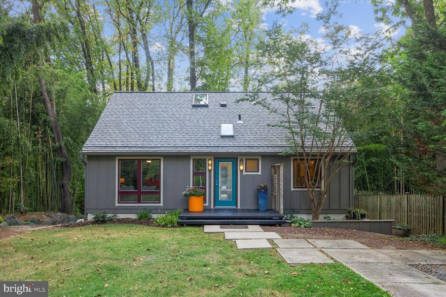 This renovated home on a private lot in Historic Capitol View Park has been reimagined with a Mid-Century Modern vibe.  Set back from the road with a driveway for 2 cars and a cut-out in front for a 3rd vehicle.  The tiled foyer leads to a coat closet and powder room.  Wood floors throughout main level. Main level primary suite features carpet, built-ins, 3 large closets with organizers and  a private bath with radiant flooring.  The light filled living and dining area leads to a large deck overlooking your private back yard, perfect for entertaining.  Floor to ceiling windows and skylights let in even more light.  The kitchen features beautiful cabinetry, granite counters and stainless steel appliances.  The deck is also accessible via a sliding glass door in the kitchen.  There are 2 additional bedrooms and a full bath on the upper level.  The lower level features a large tiled rec room that leads to the back yard from sliding glass doors.  There is another bedroom/office/gym/craft room on the lower level and a full bath.  Brand new HVAC installed August 2023.  Water heater 5 years old, brand new roof.  There is a shed attached to the right side of the house. Close to the walking trails of Rock Creek Park, Forest Glen Metro, Saturday farmers’ market and Antique Row in downtown Kensington.  Nearby access to 495 for easy commuting. Open Sunday 1-3. The empty lot across the street is owned by the State of Maryland and administered by Montgomery County as a contributory part of Rock Creek Park. See floor plans in disclosure packet.