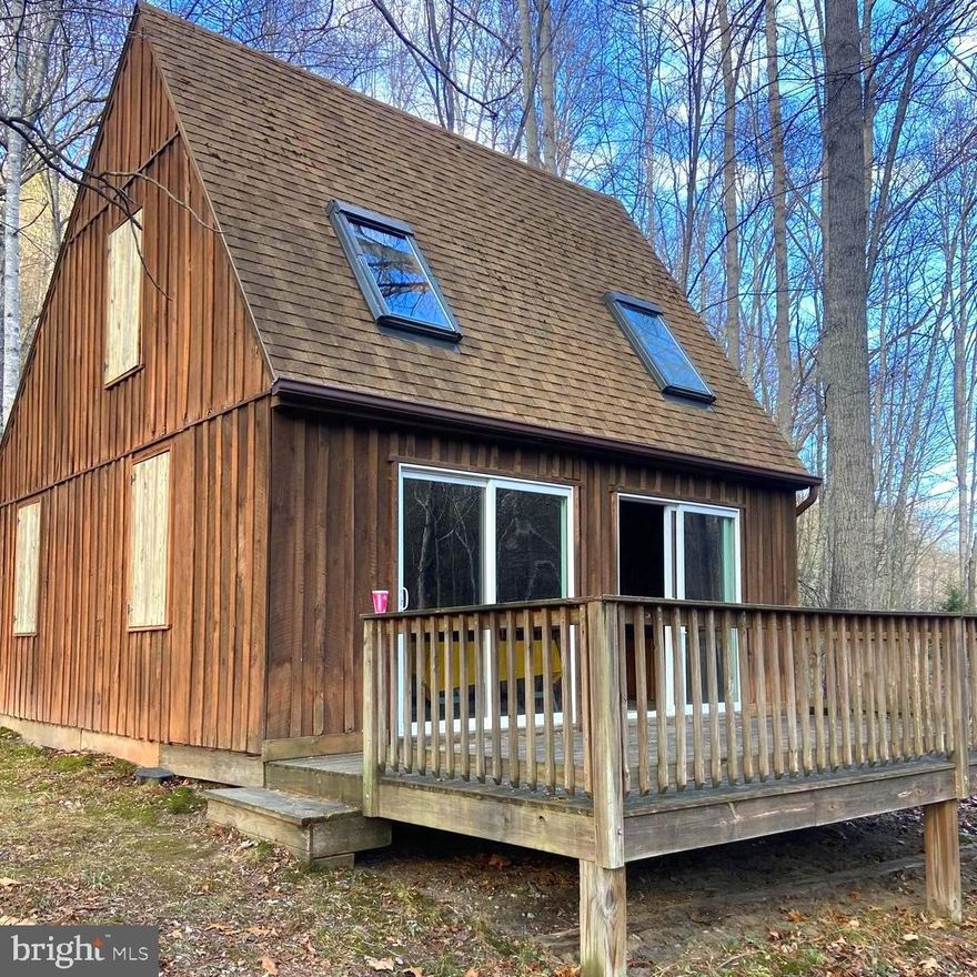 This cute , well built and well maintained cabin is waiting for your final touches!!  Located on almost 6 acres in Ritter's Hidden Valley, you can enjoy over 18+ miles of roads to ride on your ATV, a stocked fishing lake, a beautiful swimming lake, a playground and tennis courts.   The land also has a small stream that runs through it.  Plat and deed and will be uploaded as soon as they are received from Hampshire County on 12/4.