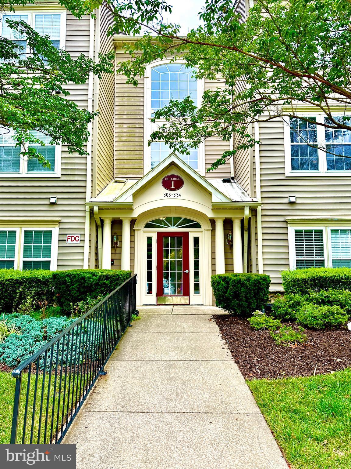 Amazing opportunity to own a ground floor 2br/2ba condo in Glyndon Trace Community. Elevator! Walkout patio with retractable screen and awning. Lots of natural light and large windows looking out to nature and woods. Gorgeous stone gas fireplace, large eat-in kitchen w/ laundry closet, dining room and living room. French doors open to office. MBR w/large, oversized bath, walk-in closet. Guest bath has hall and 2nd BR entrance. Must See! Selling AS-IS! Community pool w/ meeting room.