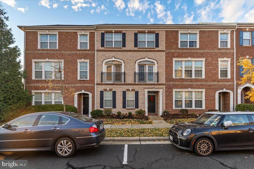 Welcome home to 19461 Xerox Drive in vibrant Lansdowne Town Center! An absolute Gem! This brick-front beauty delivers generous space, sun-filled rooms, and fantastic updates in one of Loudoun’s most walkable and fun communities. The entry level welcomes you with a spacious foyer and a flexible office/optional bedroom with two closets and a connecting powder room, plus easy access to the two-car garage. Hardwood stairs lead you to the main level, where gorgeous hardwood floors flow throughout. The living room shines with two sets of French doors and transom windows, crown molding, and a ceiling fan. The dining room offers elegant moldings and opens to the stylish, table-space kitchen featuring granite counters, tile backsplash, a large center island, pantry, and stainless-steel appliances (2021), along with access to the main deck.
Upstairs, you'll find three bright spacious bedrooms, two full baths, and a convenient laundry closet with new washer and dryer (2021). The primary suite impresses with a tray ceiling, private balcony, two custom closets, and a spa-like bath with soaking tub, separate shower, double vanity, and water closet. Two additional bedrooms offer great space and share a well-appointed hall bath. Major upgrades include a new roof (2022), HVAC (2023), cooktop (2022), and several new appliances (2021).
All of this is just steps from the amazing shops, dining, coffee spots, and conveniences of Lansdowne Town Center—plus parks, walking paths, golf, a clubhouse, fitness center, and pool. Minutes to One Loudoun, Downtown Leesburg, Route 7, Route 28, and the Dulles Greenway. This is the perfect blend of comfort, style, and unbeatable location!