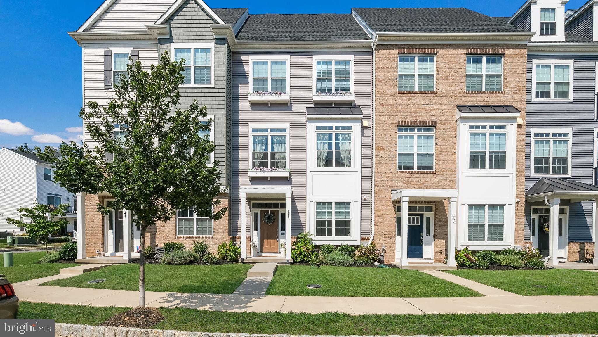 Step into style, comfort, and convenience in this beautifully appointed 3 bedroom, 2 full and 2 half bath townhome with a 2-car garage and custom flower boxes, ideally situated in the vibrant Phoenixville Borough. Built in 2022 by Rockwell Builders and perfectly positioned facing the community green space, this home offers the rare combination of modern finishes and walkability to downtown Phoenixville’s shops, restaurants, and entertainment. Inside, the lower level greets you with wide-plank hardwood floors, custom shiplap walls, and a versatile home office or flex room behind French glass doors. A bay window, crown molding, recessed lighting, and a convenient half bath add both function and flair. The garage is fully finished with painted drywall, trim, and includes a water softener system. Ascend the upgraded oak staircase with white balusters to the main living level, where open-concept design meets curated finishes. Enjoy 9-foot ceilings, custom board and batten accent walls, a designer light package, and a gas fireplace flanked by built-ins with butcher block counters, floating shelves, and a beverage fridge—perfect for entertaining. The dining area connects seamlessly to a chef’s kitchen featuring a large center island, stainless steel appliances, upgraded tile backsplash, and ample storage. Tall windows fill the adjoining family room with natural light, and just outside, the spacious composite deck with privacy panel offers the perfect spot to grill or unwind. Upstairs, the primary suite is a retreat with hardwood flooring, custom wall accents, ceiling fan, and dual closets with built-in organizers. The en-suite bath features dual vanities with upgraded lighting and mirrors, and a frameless glass shower with ceramic tile. Two additional bedrooms, a full hall bath, and a laundry room with barn door complete the upper level. With easy access to Routes 422 and 29, and just minutes from Valley Forge Park, King of Prussia, and the Philadelphia Premium Outlets, this is an unbeatable location. Don’t miss the opportunity to make 539 Bennett Street your next home—schedule your tour today!