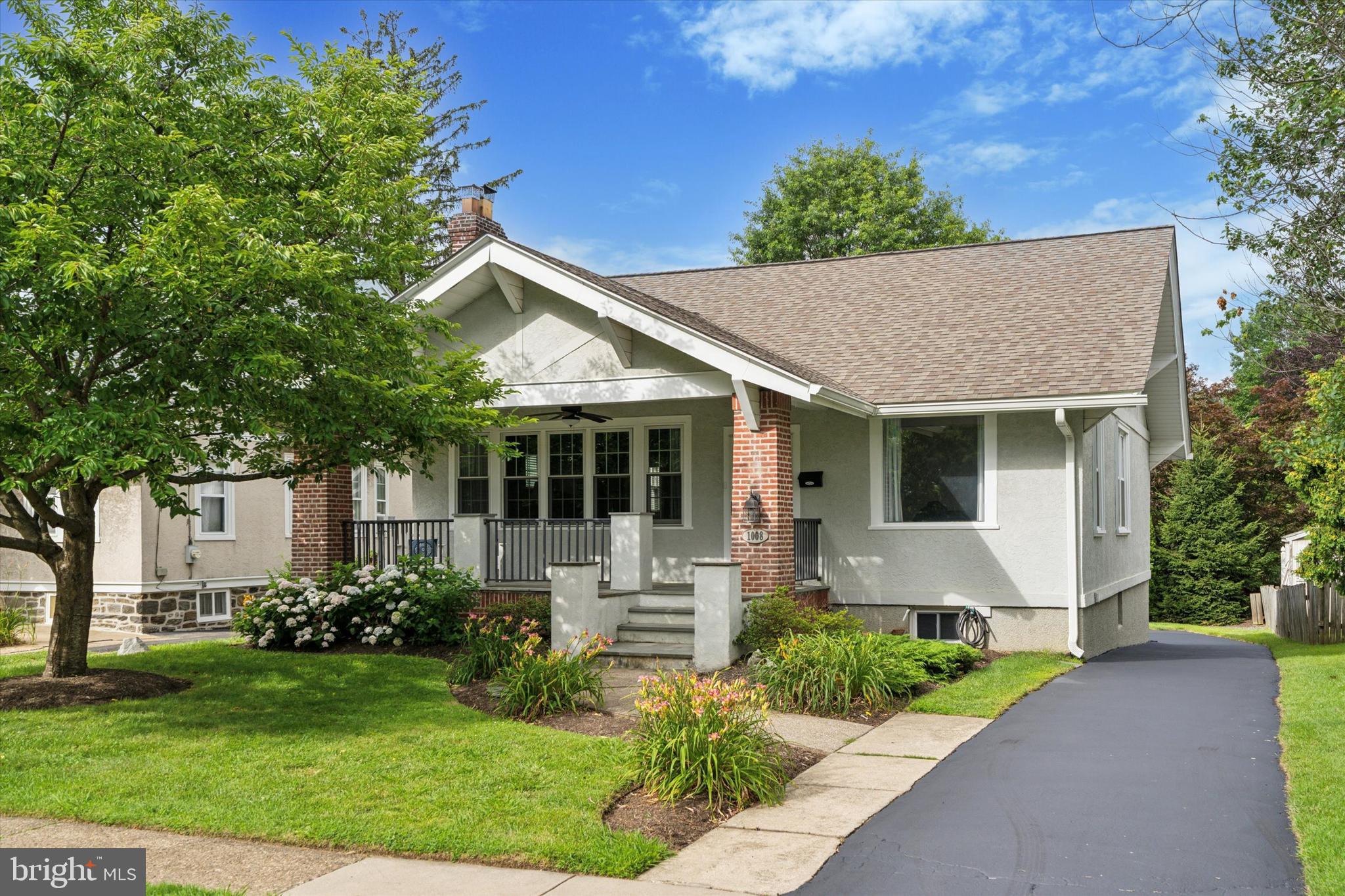 This beautifully updated American Arts and Crafts-style home blends timeless character with modern conveniences in one of Haverford Township’s most desirable neighborhoods. With easy access to the Blue Route, Turnpike, Valley Forge, Center City, and the airport, you’ll also love being just a short walk to township parks with playgrounds, ball fields, and tennis and basketball courts. Nearby amenities include shopping, public transportation, the Skatium, YMCA, Haverford Township Library, and award-winning Chatham Park Elementary and Haverford Township Schools.
The home welcomes you with a spacious covered front porch featuring classic Pennsylvania Bluestone. Step inside to find a wide formal living room with a brick wood-burning fireplace and built-in shelving, a den perfect for a home office, and a formal dining room filled with natural light. The eat-in kitchen features wood cabinetry, Corian countertops, a smooth-top stove, built-in microwave, and a dishwasher, with access to a large rear deck overlooking the backyard—perfect for outdoor dining and entertaining.
The main level offers a spacious primary bedroom with custom wardrobe closets, a second bedroom with a built-in wall closet, a hall closet, and an updated ceramic tile bathroom. Upstairs, a cozy loft sitting area leads to two additional bedrooms and ample attic storage.
The finished lower level expands your living space with a family room, full bathroom with stall shower, laundry area, cedar closet, workshop space, extra storage, and convenient access to the garage and rear yard. Recent upgrades include a brand-new roof, new heating and central air systems, a fully replaced sewer line, and an upgraded 200-AMP electric panel. With hardwood floors and neutral paint throughout, this home exudes charm, has been thoughtfully updated, and is completely move-in ready. Don't miss your opportunity to own this home.