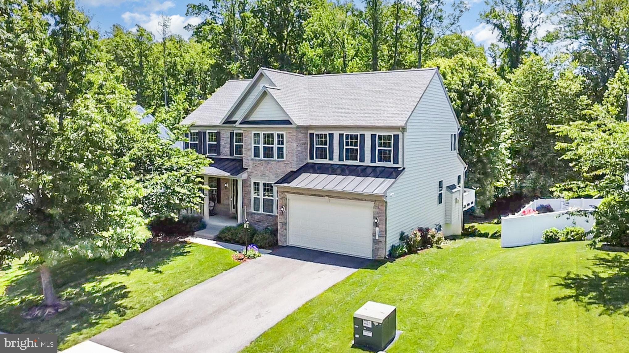 Welcome to 21 Berea Knolls Drive. This stunning colonial HAS OVER 4700 SQUARE FEET to stretch outt in and is tucked just off Route 17 in Stafford County, Virginia. Living here offers the best of both worlds—you’re close to the hustle and bustle of the shopping and dining that Route 17 provides, as well as the charming lifestyle of downtown Fredericksburg, known for its quaint shops, boutiques, historical plaques, and unique local eateries. There's so much more waiting for you to explore!
As you enter your next home at 21 Berea Knolls Drive, the elegant entryway sets the tone. This welcoming space gives you a chance to showcase your personal style from the very beginning. Immediately to your left, the formal living room awaits. With classic crown molding, front-facing windows, and beautiful hardwood floors, this room is both timeless and inviting. Always dreamed of a personal library, parlor, or game room? This flexible space is full of possibilities, ready to match your lifestyle.
Just beyond, the formal dining room is drenched in natural light, drawing attention to the craftsmanship of the detailed walls. Wainscoting and a tray ceiling elevate the space, making it perfect for special occasions. The stunning hardwood floors lead you into the heart of the home—the kitchen. Featuring a spacious island and adjacent breakfast room, this area truly says "welcome home." With ample counter and cabinet space, this kitchen is a dream for chefs and bakers alike.
Don’t need a breakfast room? The abundance of windows makes this area perfect for a sunroom. Birdwatching, anyone? You’ll also enjoy easy access to the deck, creating a seamless indoor/outdoor dining experience. Whether you’re dining al fresco or just popping back in for a drink, this setup is a dream come true.
Back inside, the informal living room awaits—complete with a gorgeous stone-front fireplace and plenty of natural light, making it a great space for entertaining. The main level also includes a home office, offering even more versatility. Whether you call it an office or a den, it’s ideal for productivity—or just relaxing!
Upstairs, the primary suite is a showstopper. Plush carpeting, a tray ceiling, and abundant natural light make it the perfect retreat. The ensuite bathroom offers a true spa-like experience with marble flooring, a soaking tub, an updated shower, and dual vanities. The walk-in closet is the cherry on top. Three additional bedrooms and another full bathroom complete the upper level.
On the lowest level, imagination has room to flourish. The finished basement is the perfect canvas for your projects, passions, or hobbies. A bedroom and additional living area provide excellent guest accommodations or multigenerational living. Previously used as a beloved movie theater, the bonus room expands the home’s livability even further.There is even an additional flex space that has been used as a craft room that can be additional storage or a game room.
Backing to trees and featuring a patio and firepit, this home is located near the end of a cul-de-sac, offering peace, privacy, and charm. The backyard is an eco-friendly rain garden that is maintained by the HOA and enhances curb appeal while managing stormwater naturally- beautiful, sustainable landscaping with a purpose.
21 Berea Knolls Drive welcomes you to your next chapter in Stafford.