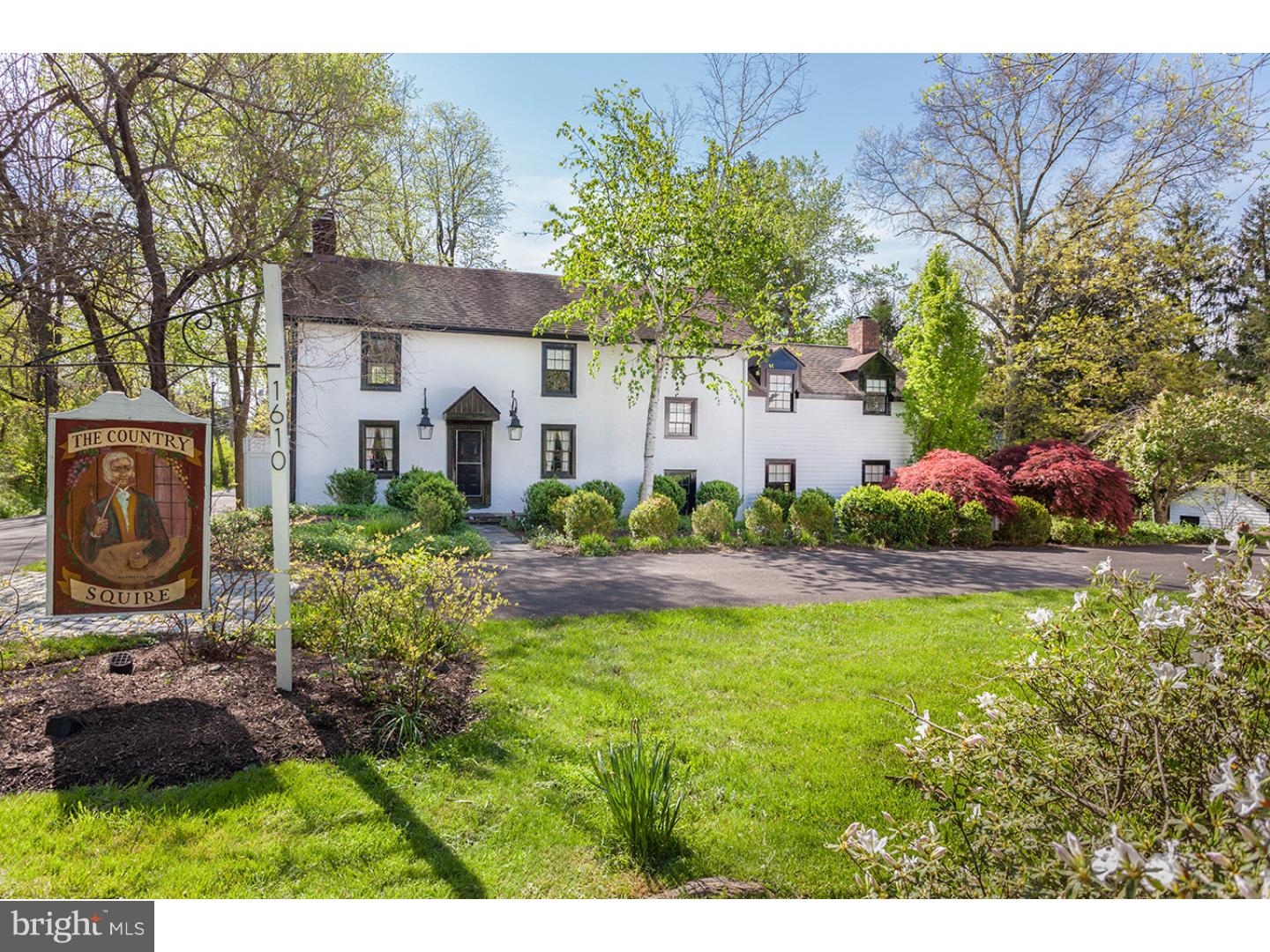 Fancy yourself a country squire? Look no further than this picturesque five-acre retreat consisting of an updated, classic Bucks County stone house, barn and beautiful outdoor spaces. Freshly updated inside and out with a quiet simplicity, this is a home that will work perfectly for those with a sleek, modern aesthetic or more traditional sensibility. Its earliest section dates to the late 1700s and has the requisite details: exposed-beam ceiling, deep-sill windows, a stone fireplace and rich wood floors. Adjacent is a sun-drenched dining room with a bay window looking out to the grounds. Just beyond is a vaulted-ceiling kitchen with casual dining area and access to a large patio, one of three. This section of the first floor also has a laundry room and newly renovated powder room. The other wing of the house steps down to an office and a family room, both rich in character with wood floors, a cozy wood-burning fireplace in the family room and access to the terrace and gardens. Private quarters are upstairs, and again, the finishes are classic, with white walls, exposed-beam ceilings and wood floors. There are three bedrooms on the second floor and two full baths. Each of the baths is beautifully updated and well-designed to add luxe touches and make the best use of their spaces. Master bath includes a steam shower. All of the bedrooms look out to the gardens and grounds. The property is just waiting to host parties with its extensive terraces, an in-ground pool with cabana, Koi pond and classic barn. The barn with port cochere offers garage space for cars, plus storage and a large, finished office. Traverse fields and a path through the woods to the Neshaminy Creek where, if you're lucky, the fish are biting. Or stay close to home and appreciate this property's character and country vistas, sure to engage you in every season.